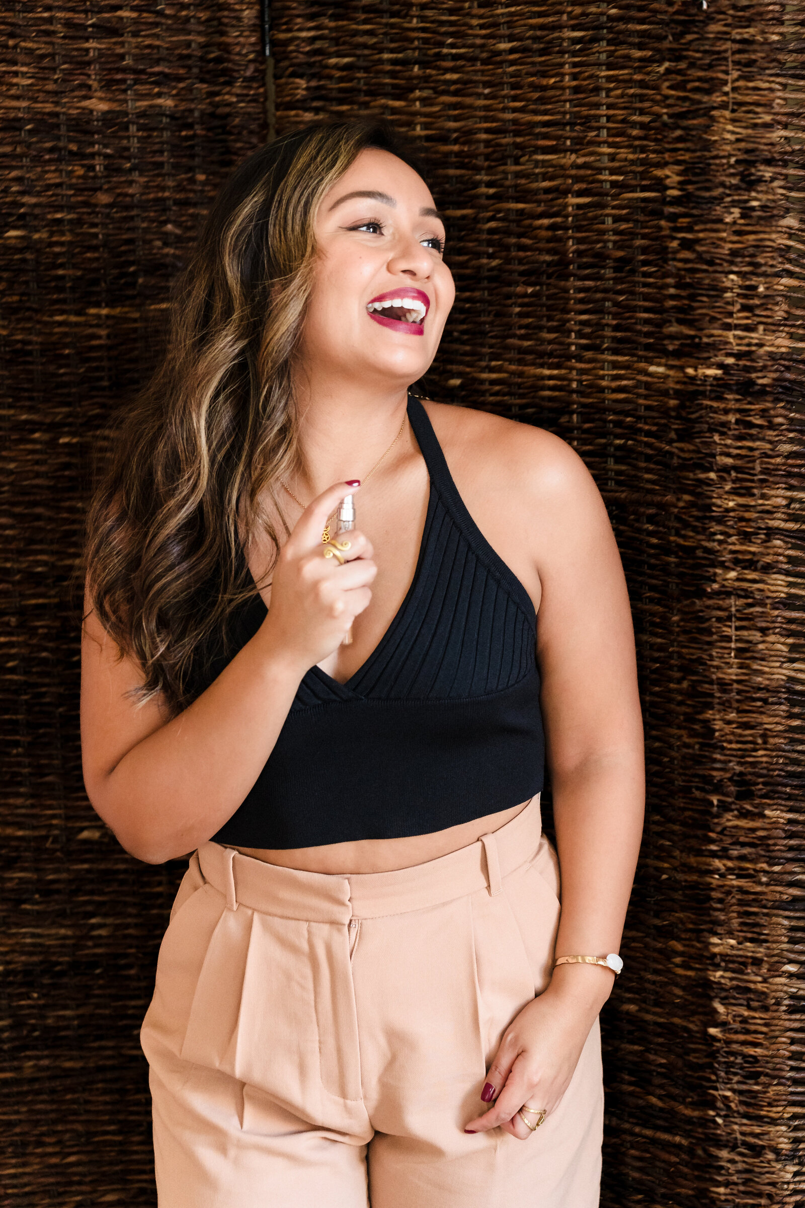 life coach plays with a perfume to showcase confidence and empowerment