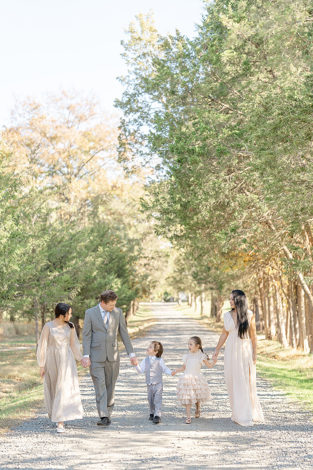 family walking while talking during Reston, VA fall mini session