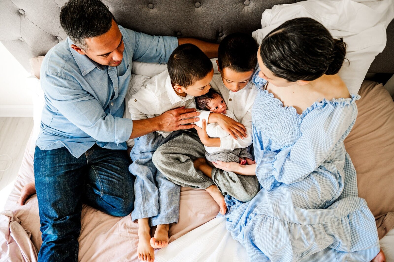 family in home with newborn baby