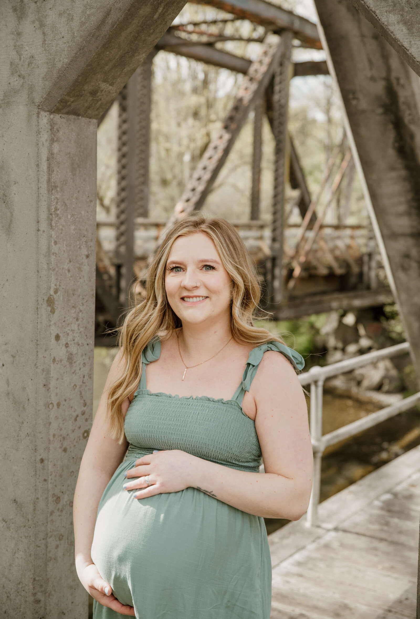 Pregnant woman holding belly.