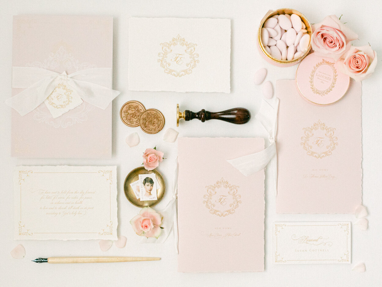 Timeless and romantic wedding invitations adorned with wax seals and white silk ribbon. Dreamy style wedding flatlay