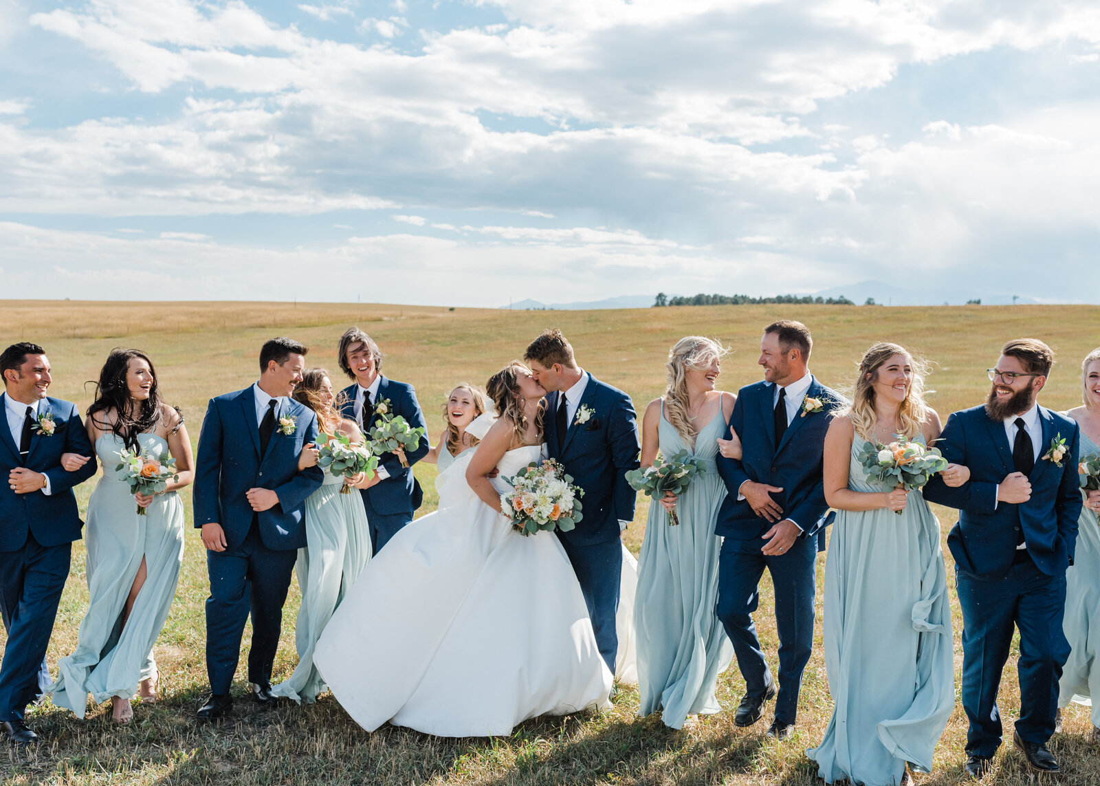 Full bridal party celebrating by Denver Wedding Photographer Erin Winter Photography