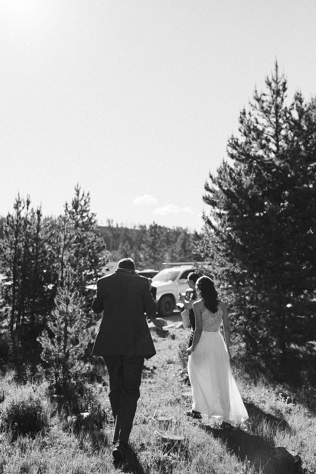 candid photo of couple walking after their Lake Dillon elopement