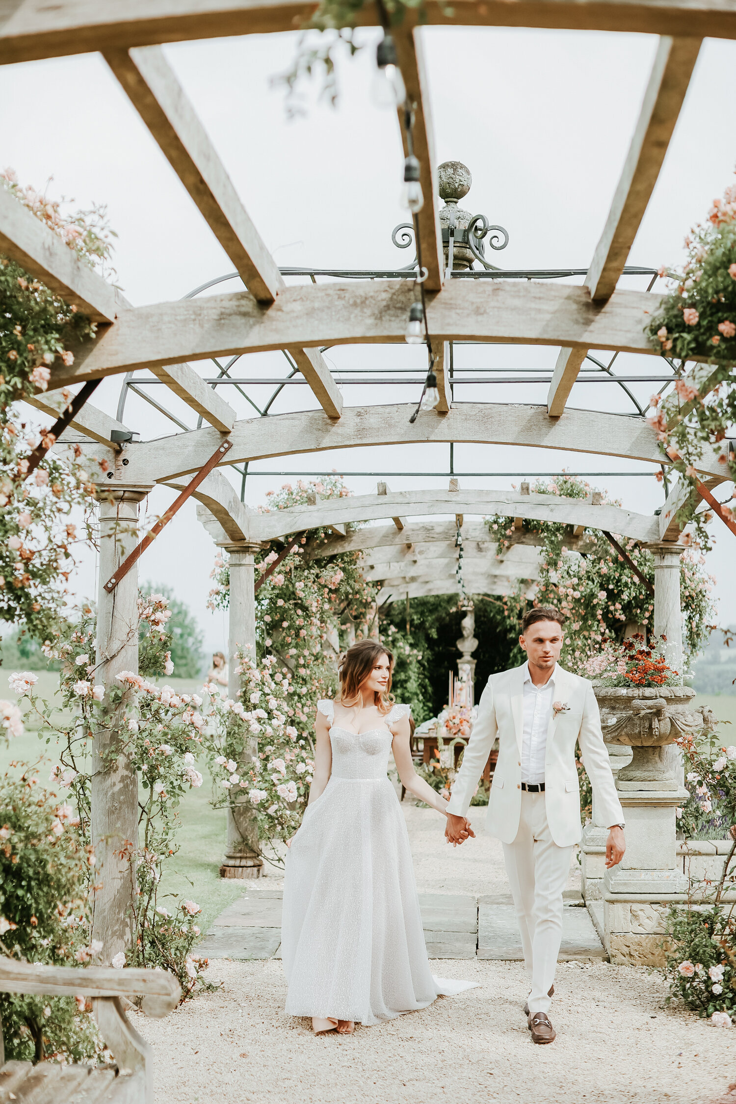 Euridge-Manor-wedding-couple-walking-under-bagoda