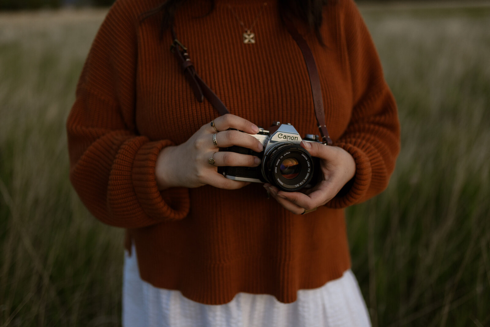 alaska elopement wedding photographer holding film camera