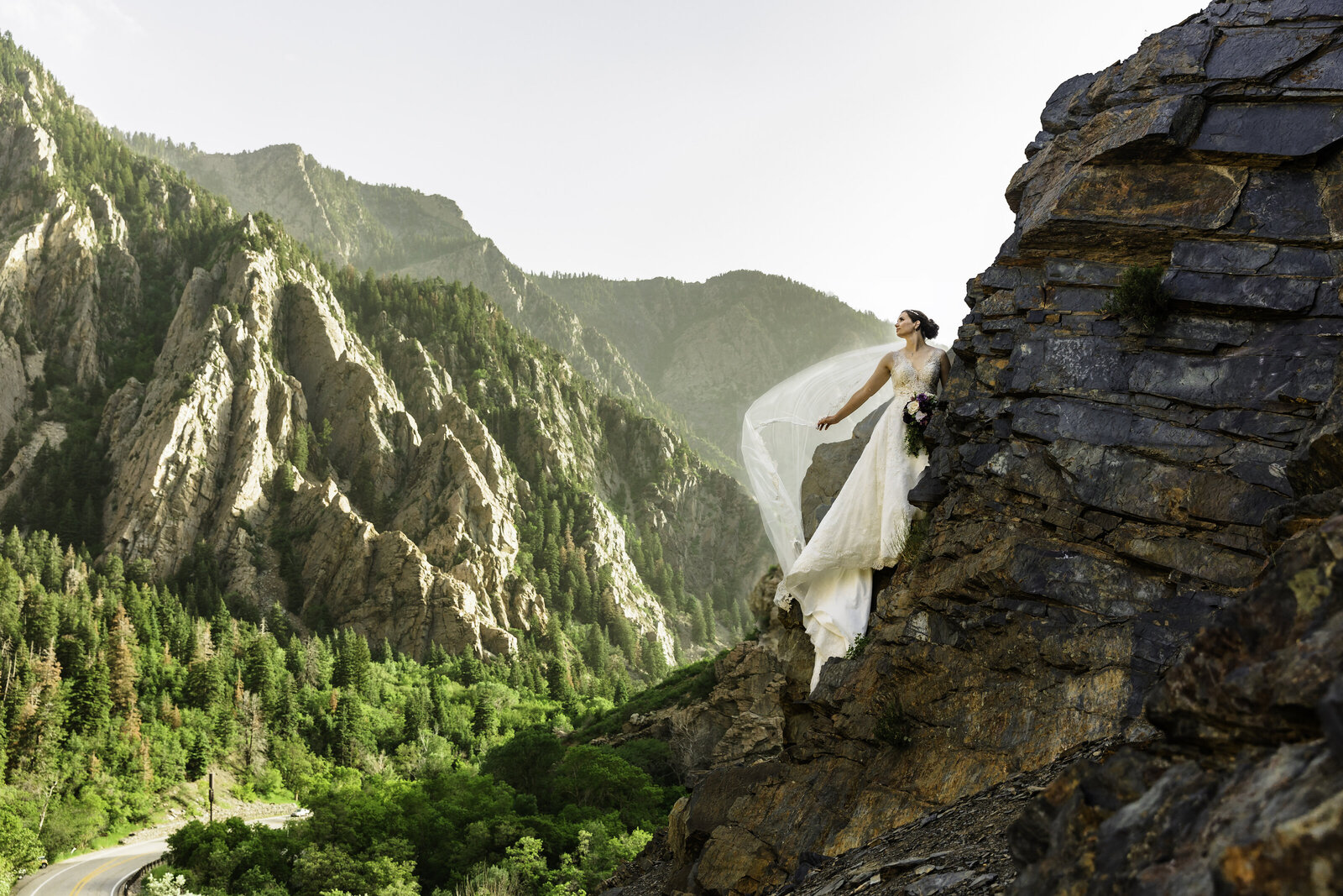 Jackson Hole photographers captures bride scaling on mountain after elopement