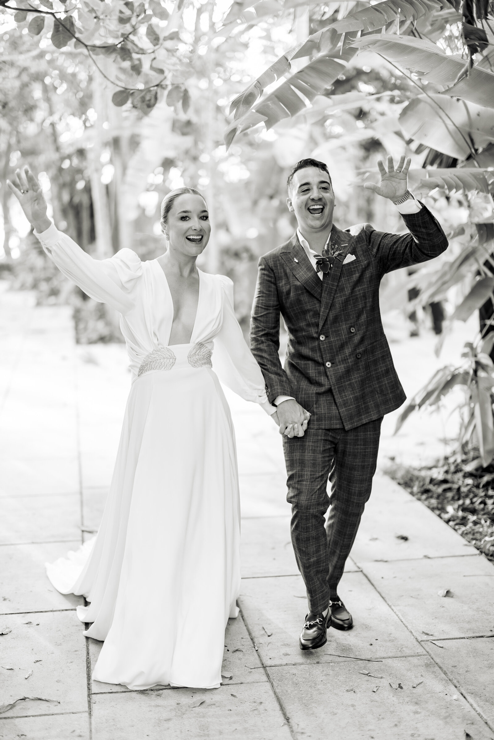 Bride and groom waiving 