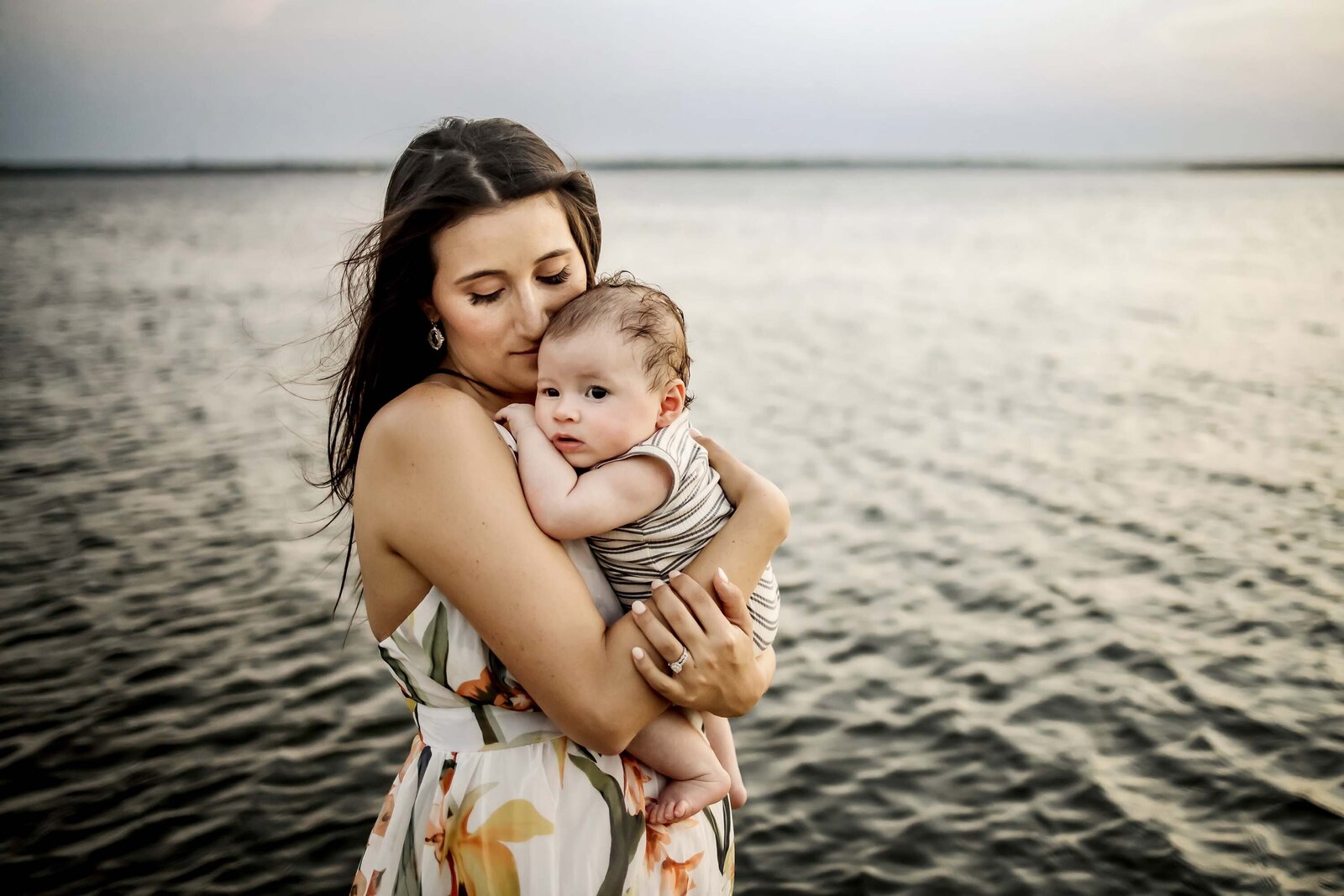 mother and infant son near the water in Grapevine Texas