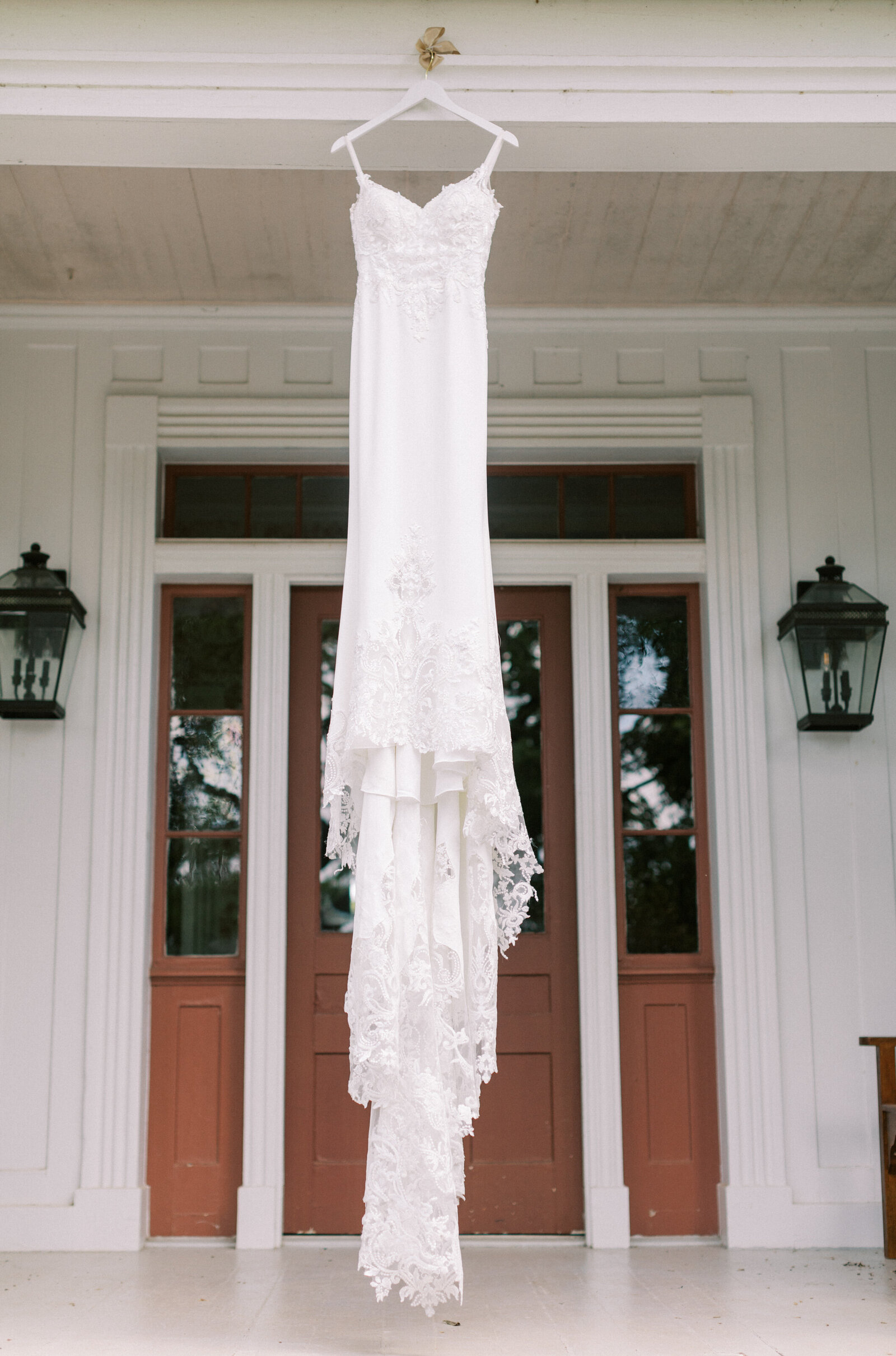 Wedding dress hanging on WolfTrap Farm house