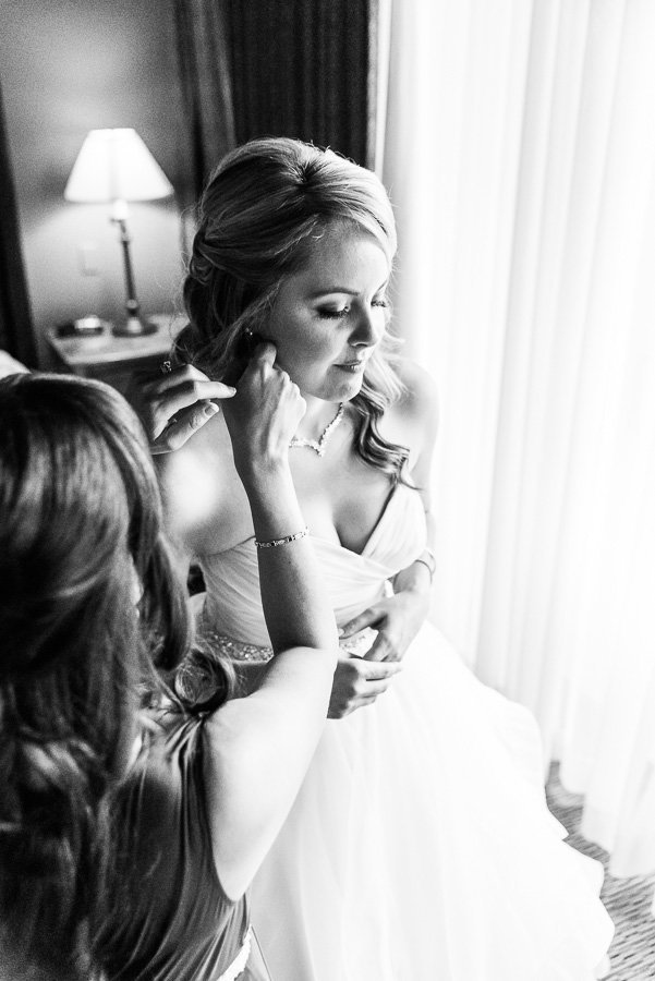 Tucson The Lodge at Ventana Canyon Wedding Getting Ready Photo of Bride Putting on Earrings | Tucson Wedding Photographer | West End Photography