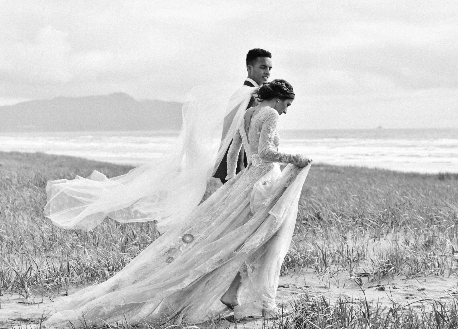 Bride and Groom walking on beach