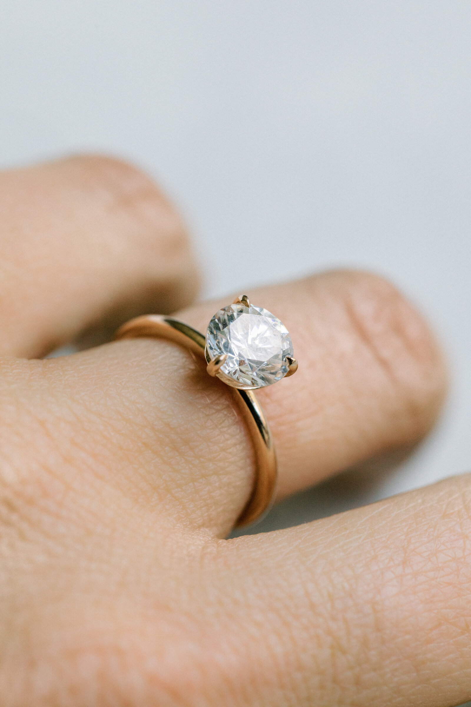 engagement ring on a finger