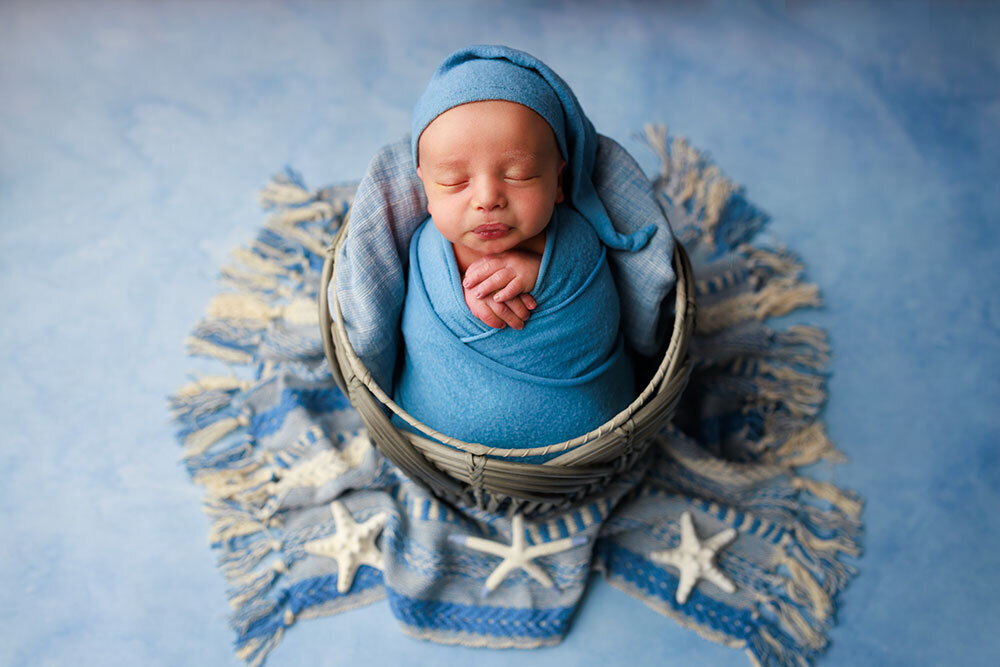 baby-boy-blue-newborn-basket-sea-shells-colorful-whimsical
