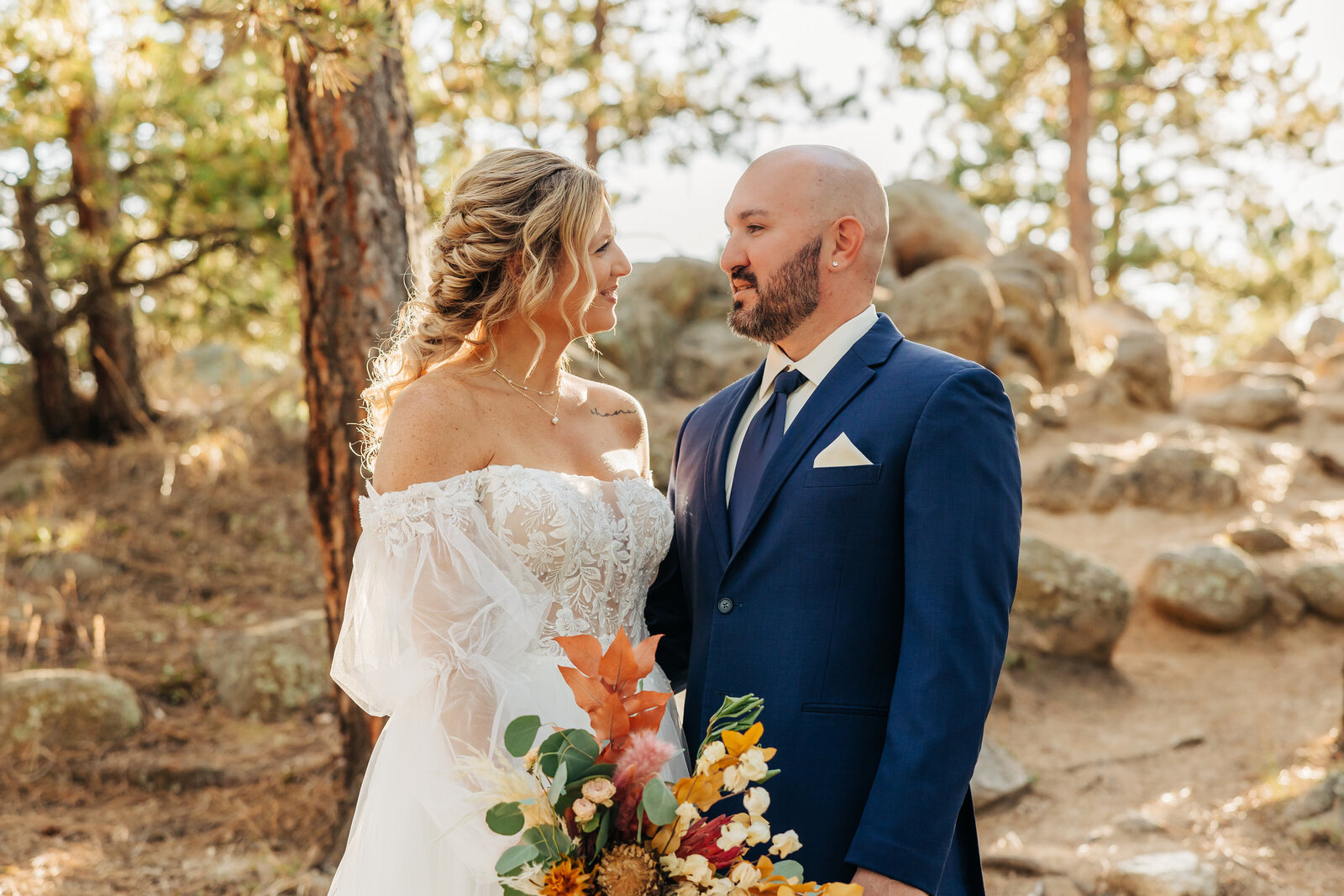 Denver Wedding Photographer captures bride and groom looking at one another during portraits