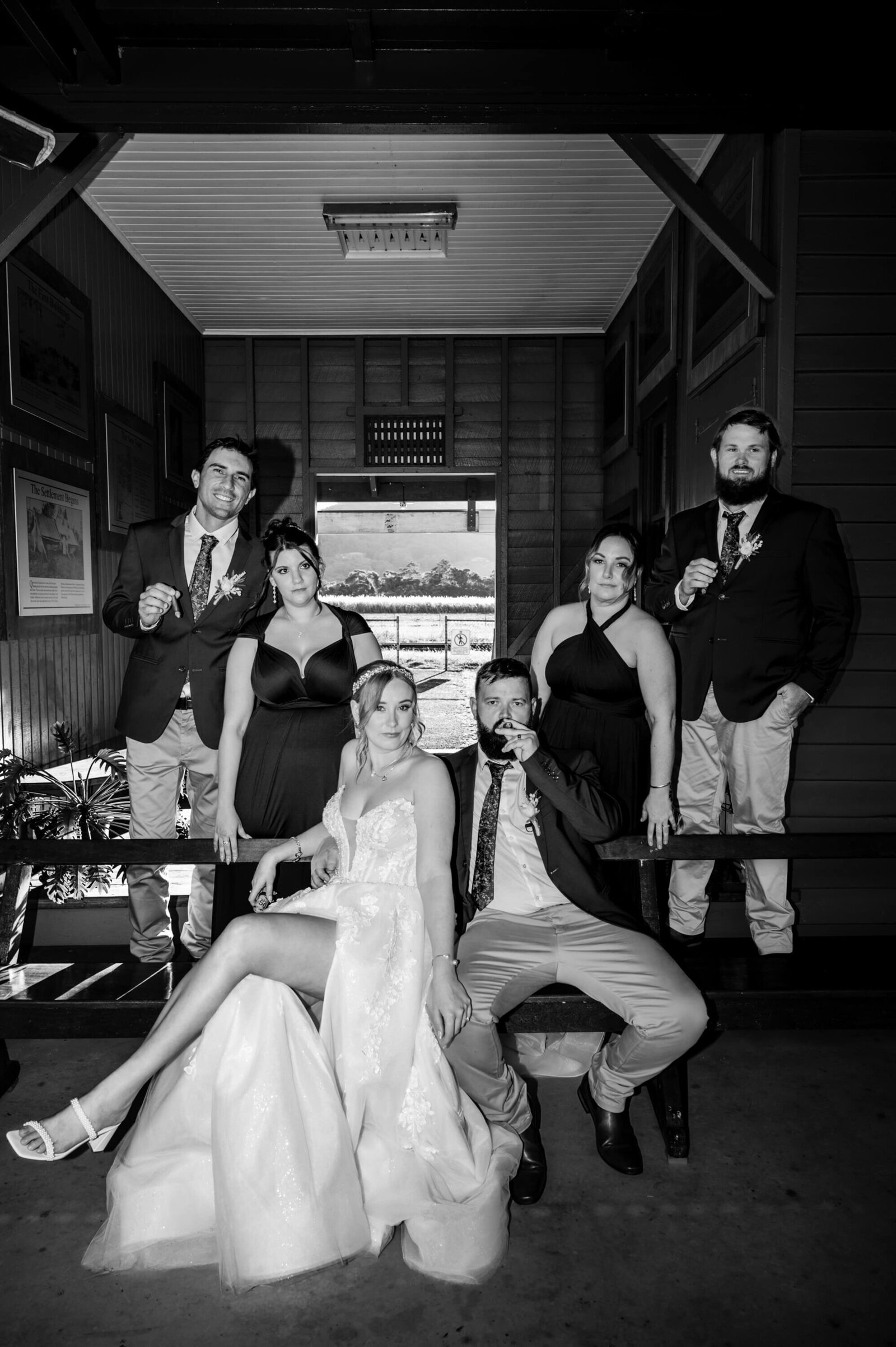 A timeless black and white photo featuring a bride and groom in a loving pose, celebrating their special day.