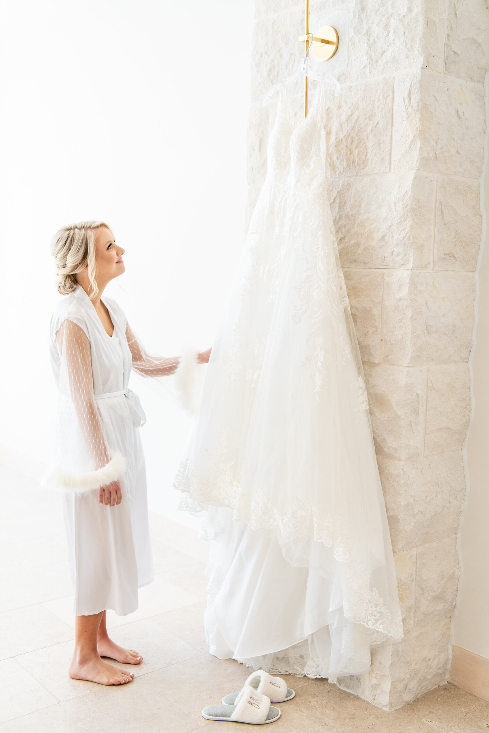 bride admiring her dress