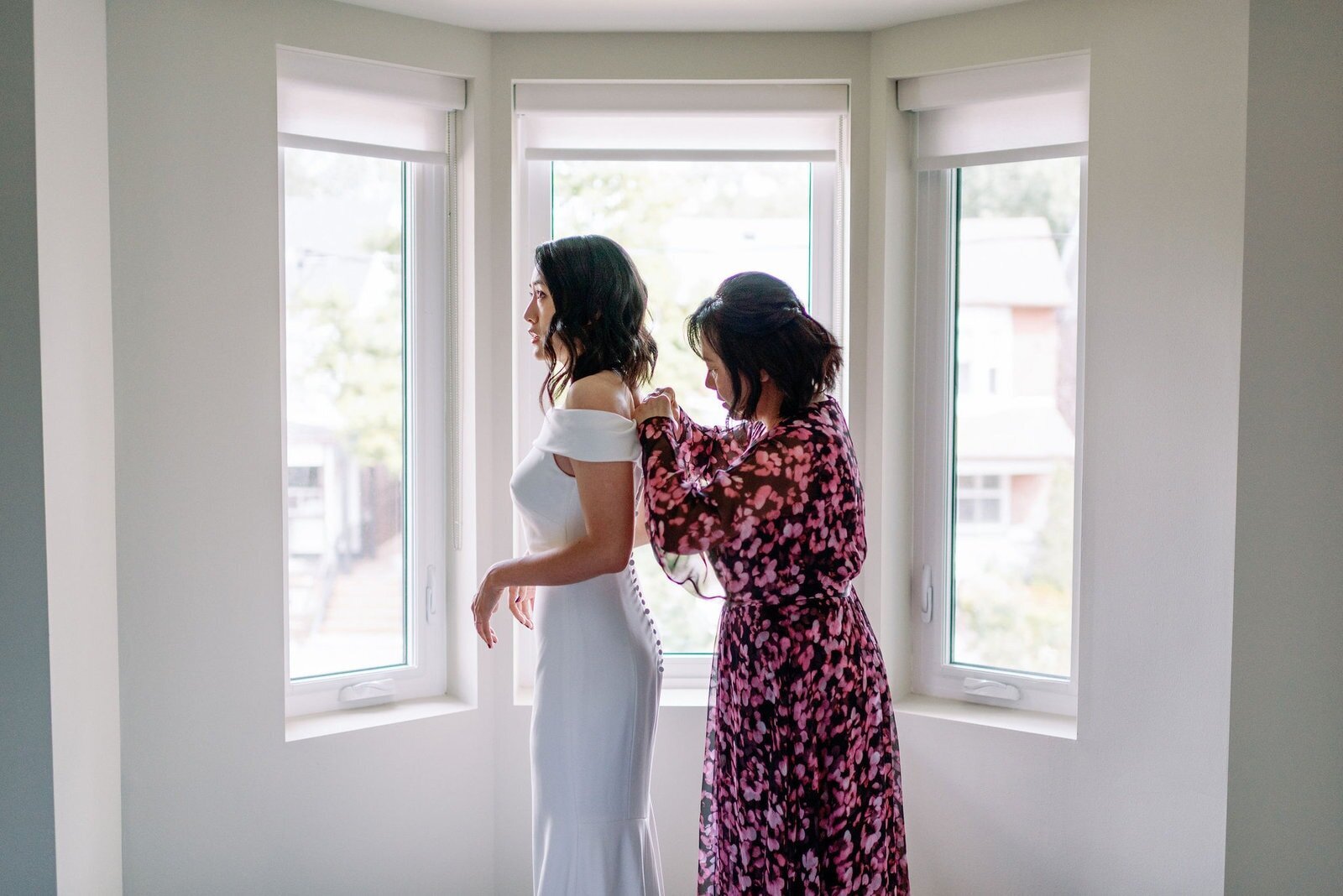 Modern Editorial Bride Slips into Wedding Dress with Mother Candid Moment Toronto Wedding Jacqueline James Photography
