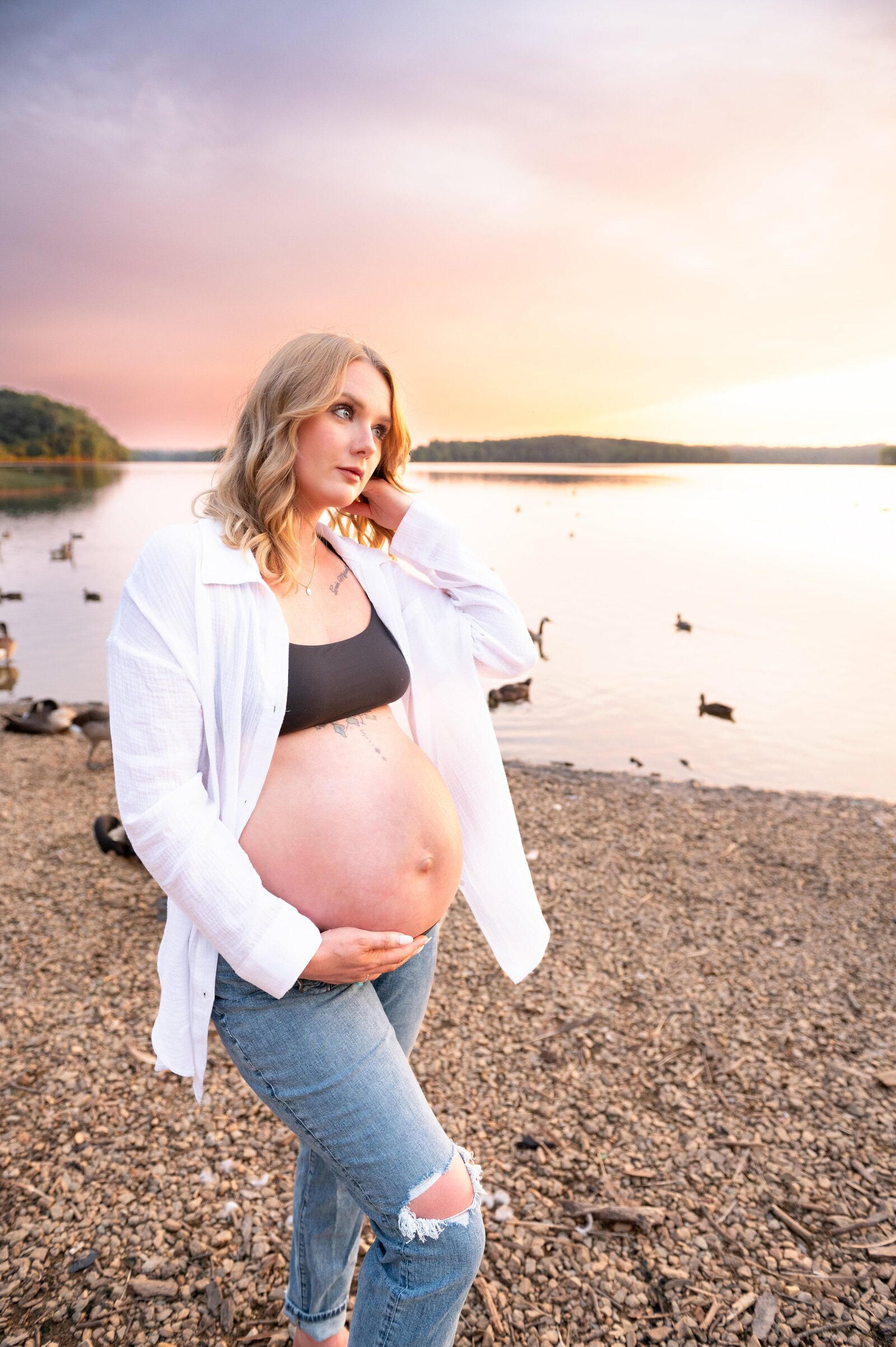 woman with her pregnant belly showing at a maternity session