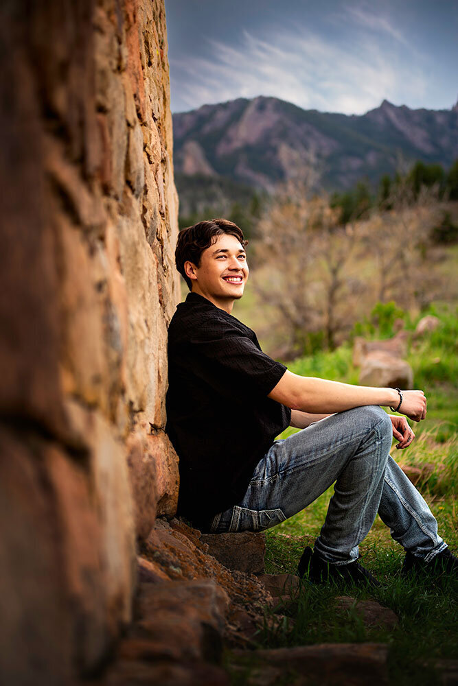 south-mesa-trailhead-boulder-colorado-senior-high-school-boy-rustic-stone-mountain-background-smiling-black-shirt-interesting