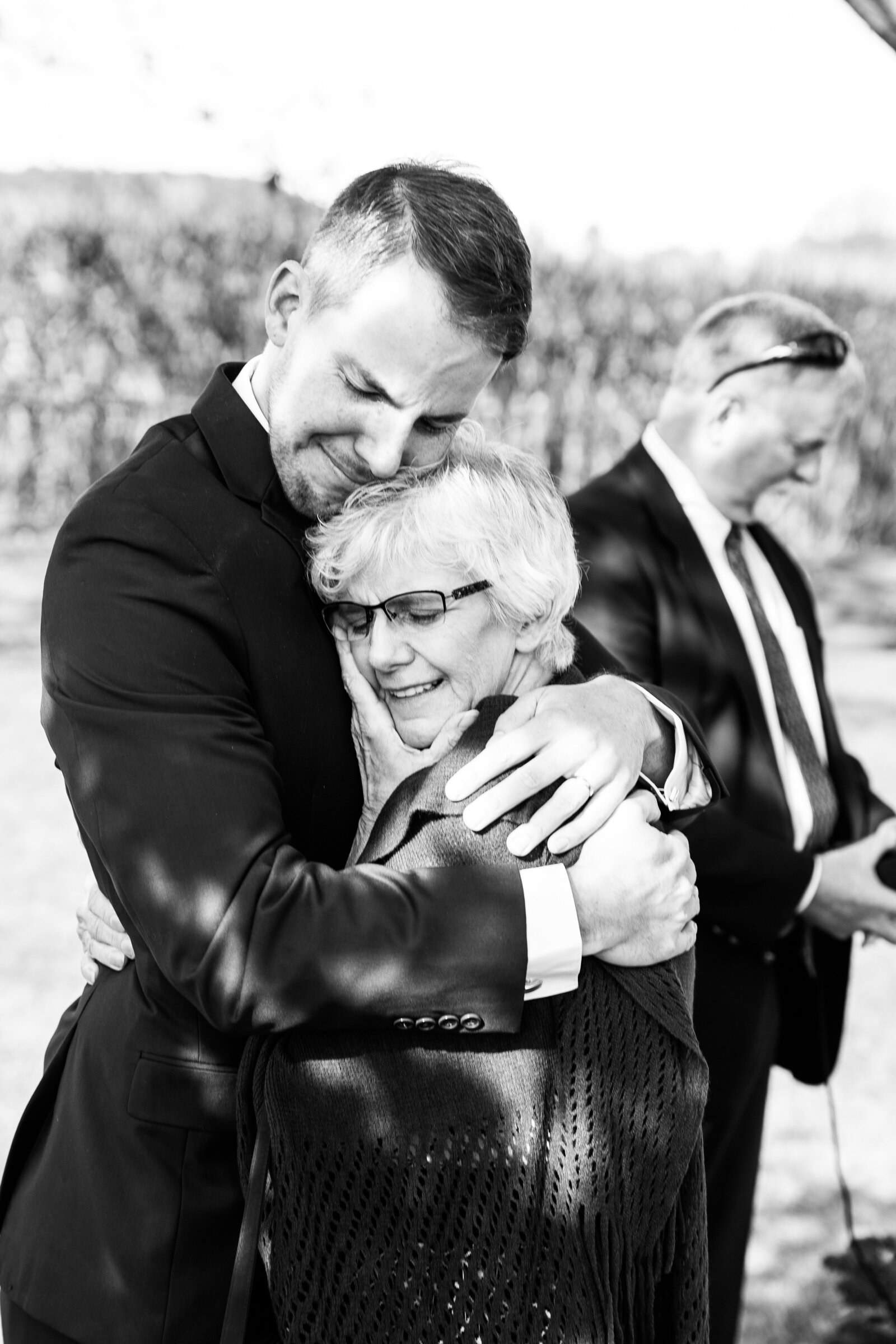 Mother of groom embracing her son after wedding ceremony in Tillsonburg Ontario