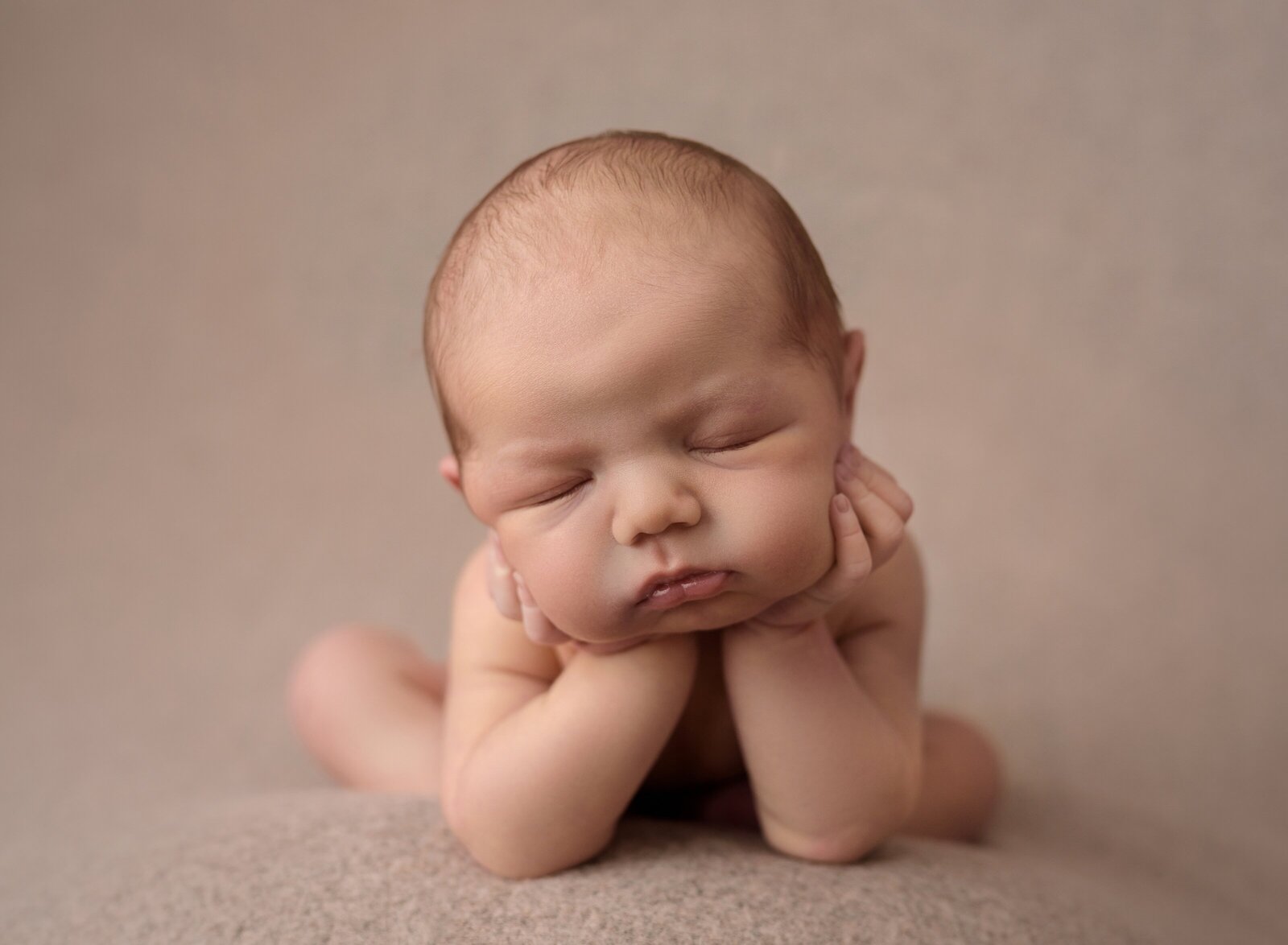 a baby in froggie pose