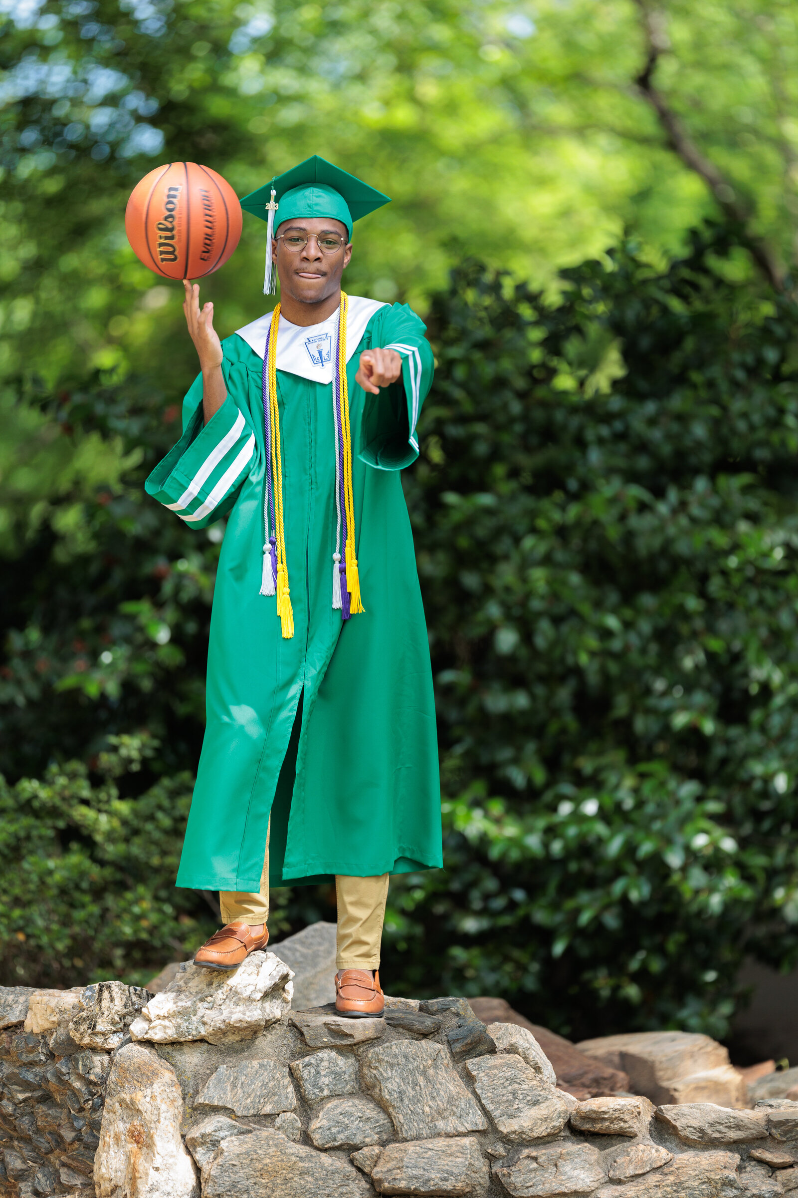 Boy in Cap and Gown with basketball