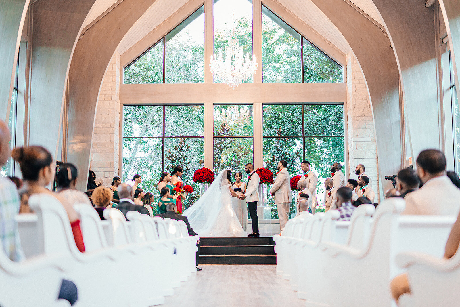 Bride and Groom standing at the alter exchanging their wedding vows