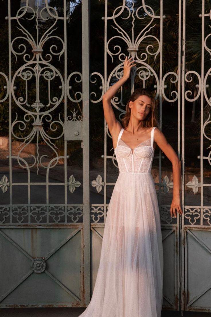 bride wearing white tulle wedding dress
