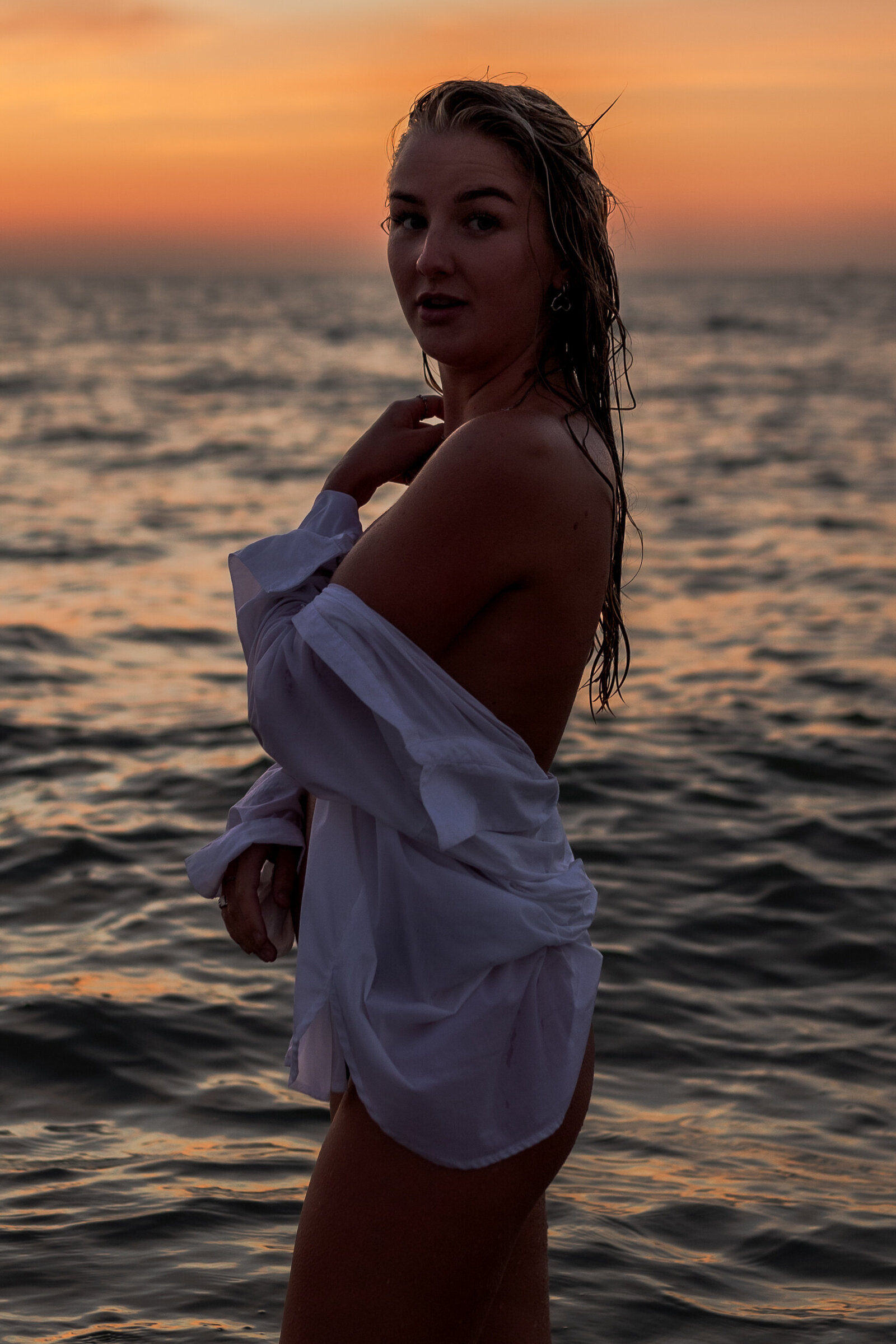 Artful composition featuring a woman intertwined with tidal patterns
