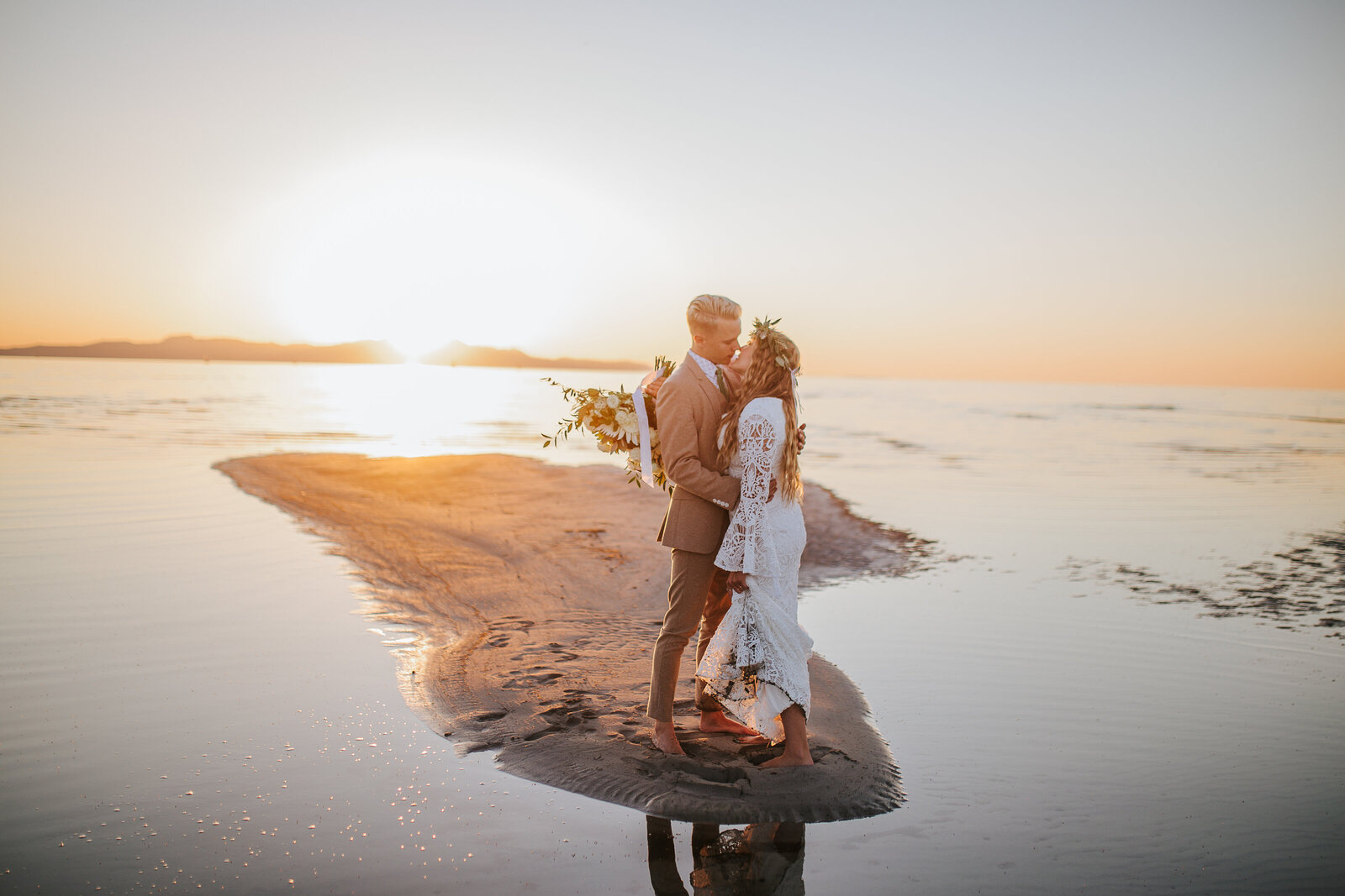 Sacramento Wedding Photographer captures bride and groom kissing at golden hour after beach elopement