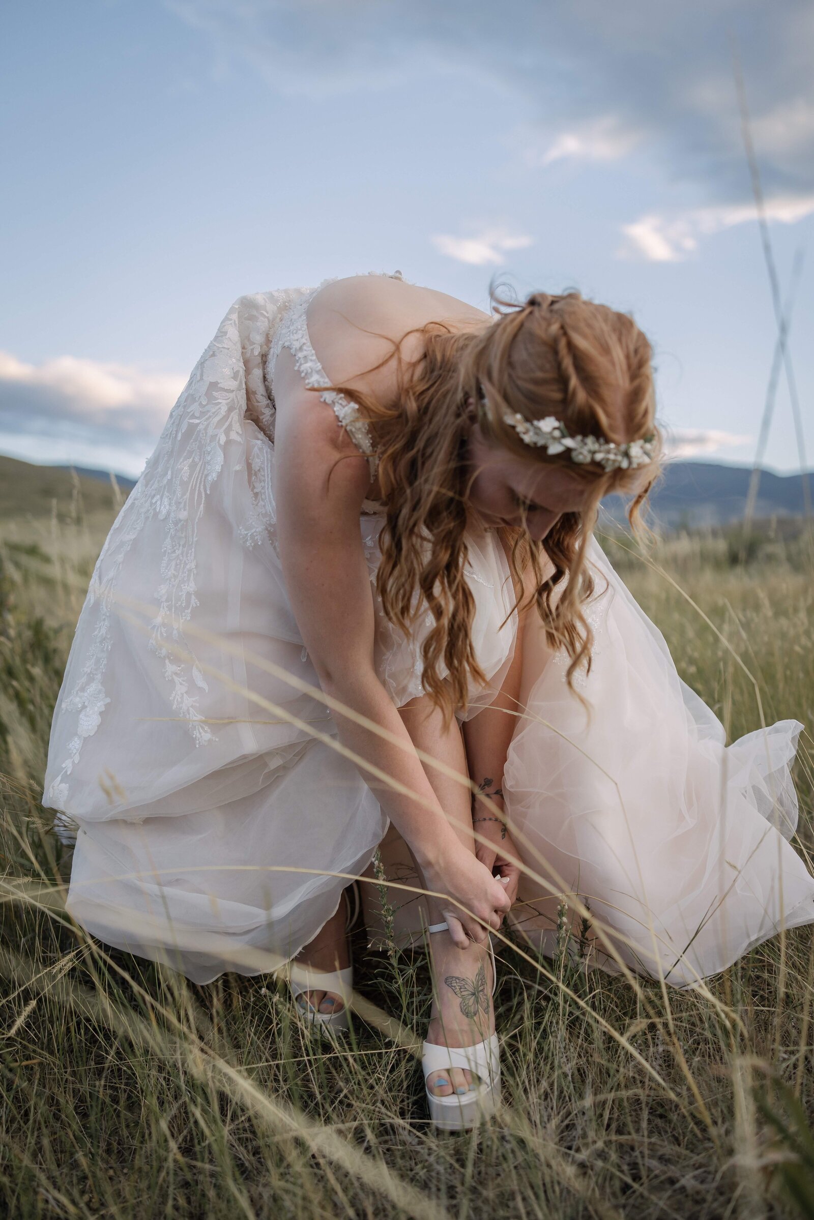 bride putting on platform heels