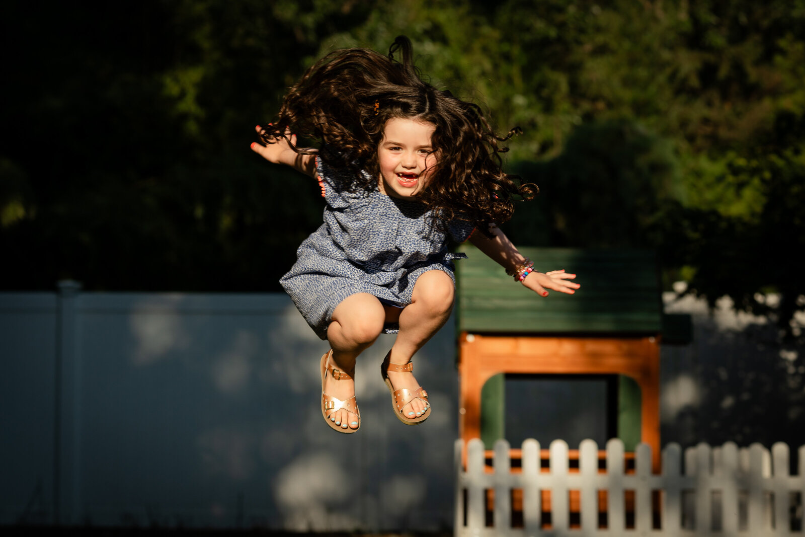 kid-jumping-backyard-nj-family-photographer