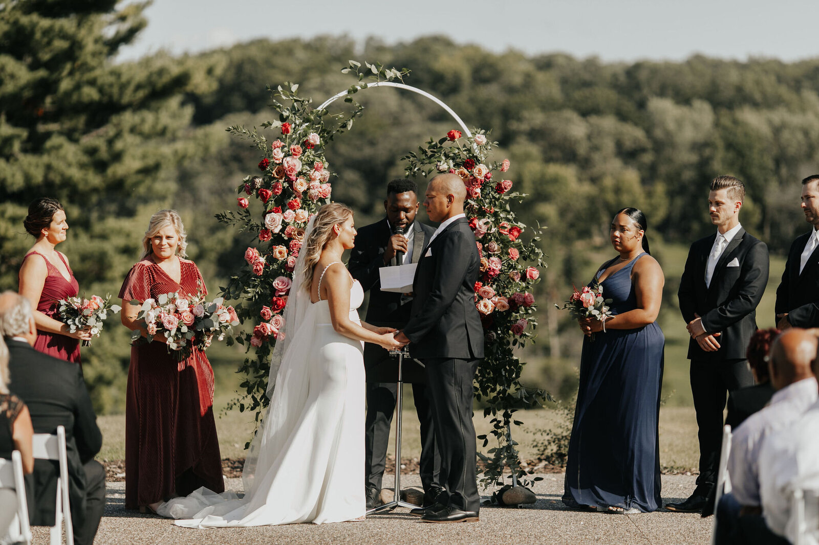 ceremony-outdoors-floral-arch-minnesota-summer