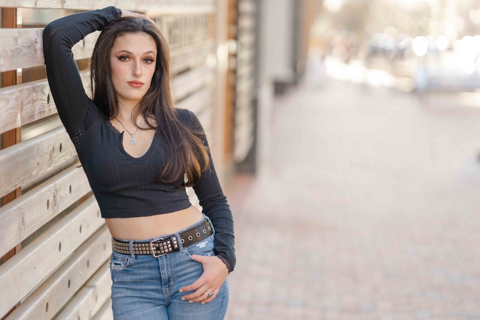 close up of a girl leaning on a wall during senior photography Fairfax County, VA
