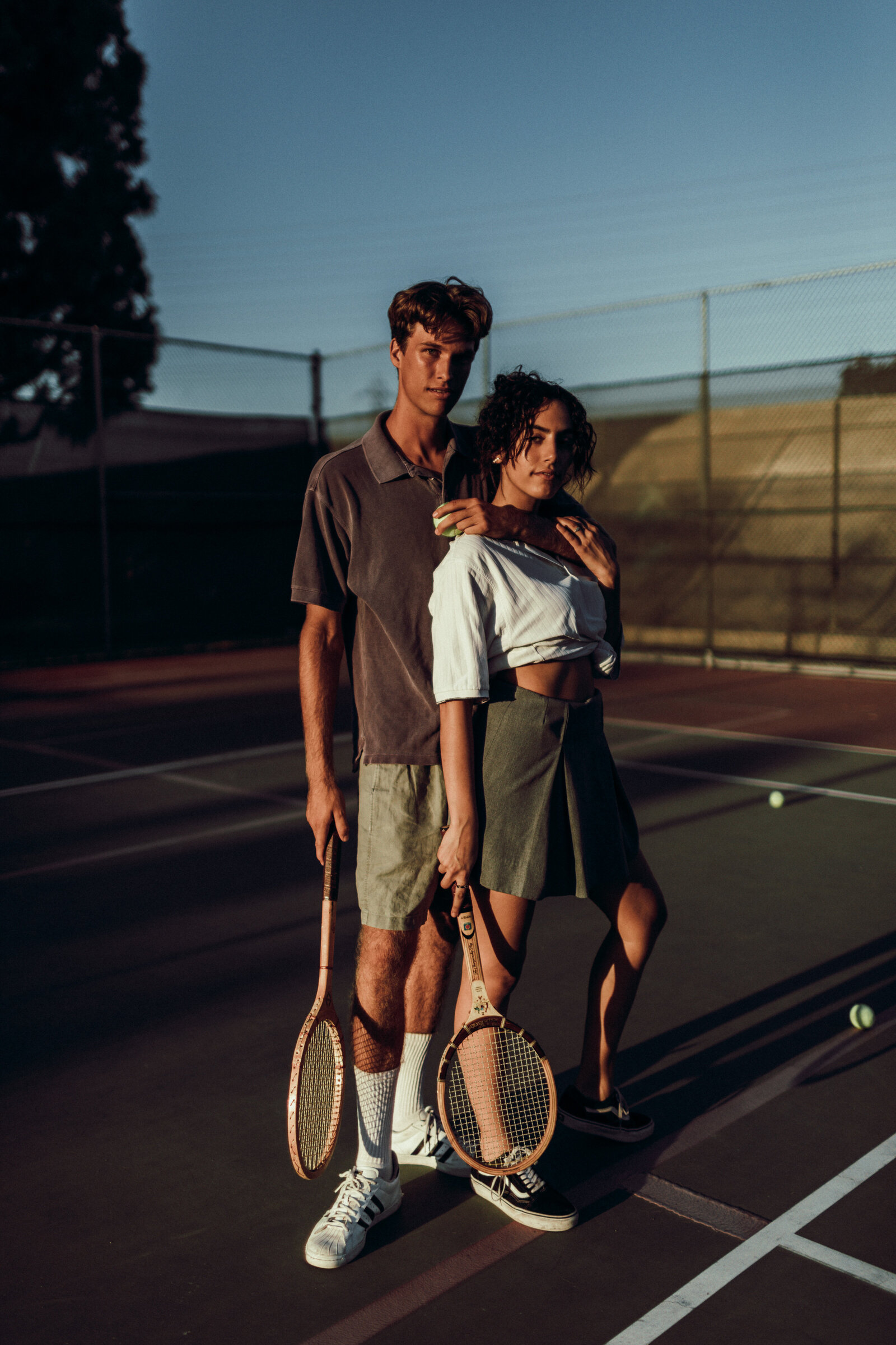 couple-playing-tennis-posing