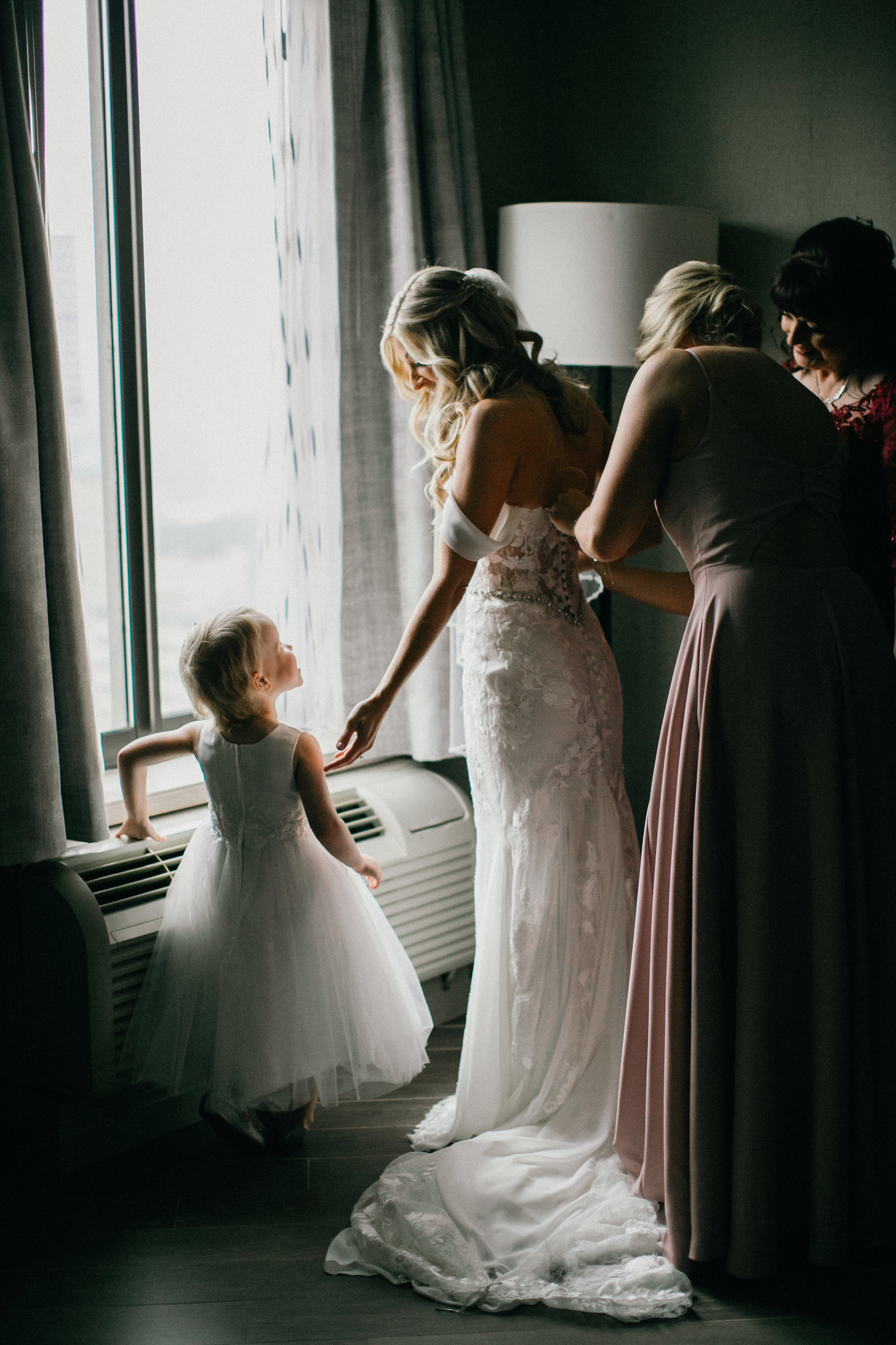 Loving bride and her daughter photographed getting ready at the Double Tree in Center City, Philadelphia.