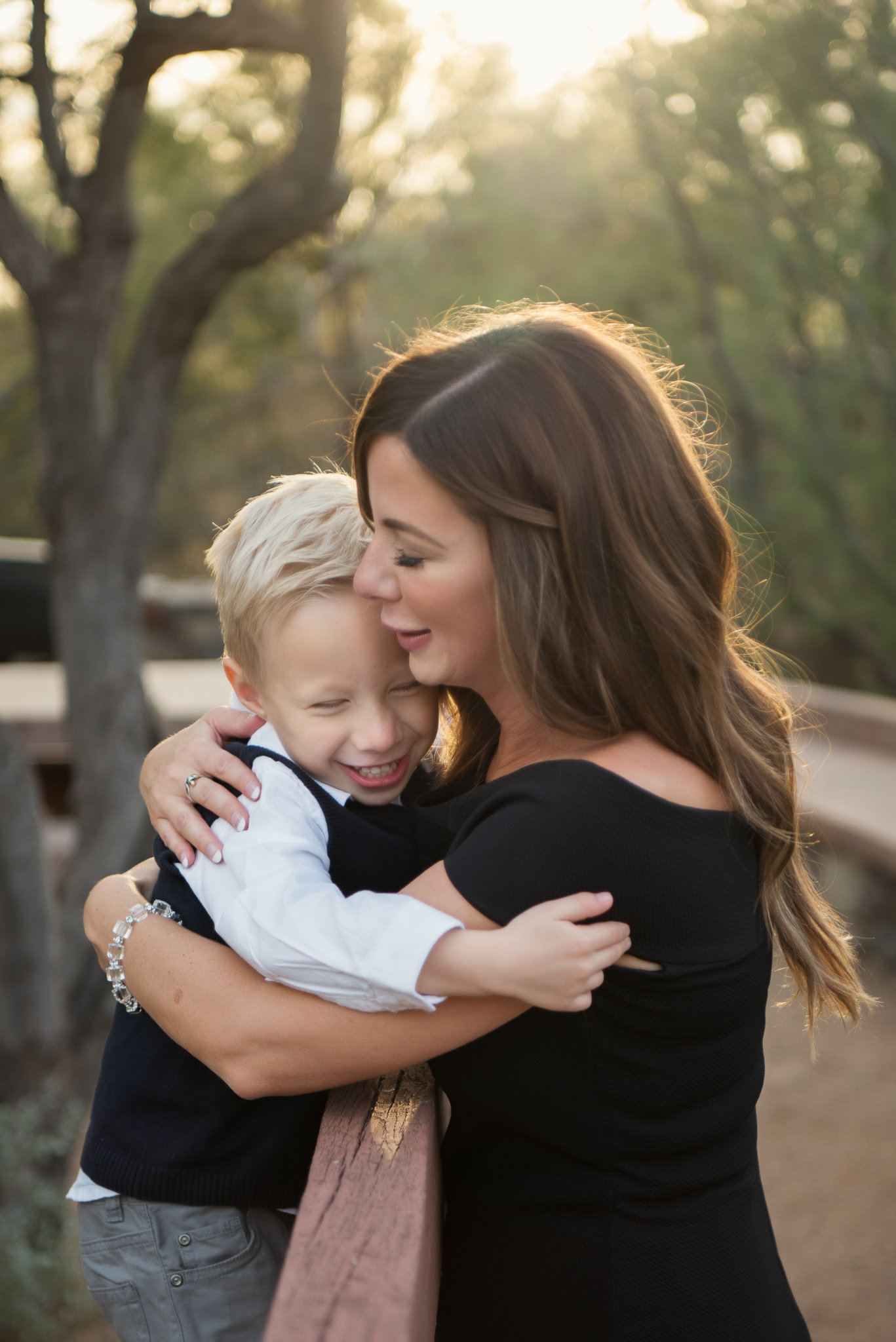 mother and son hugging and smiling