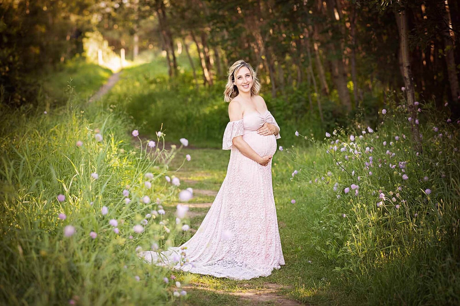 pale pink lace maternity gown outdoor photo shoot
