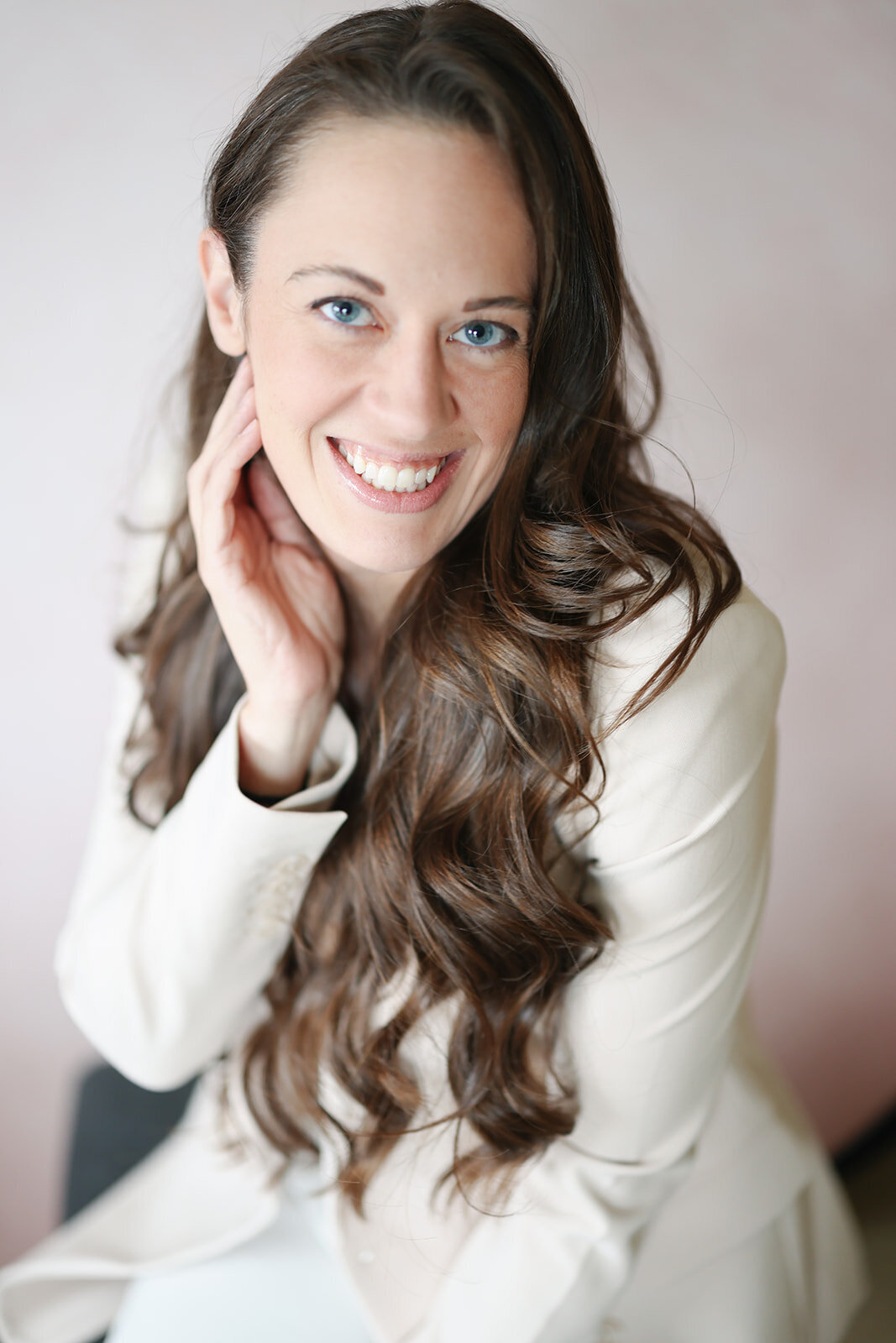 Amanda Briggs, founder and lead planner of Briggs & Co., in a white blazer