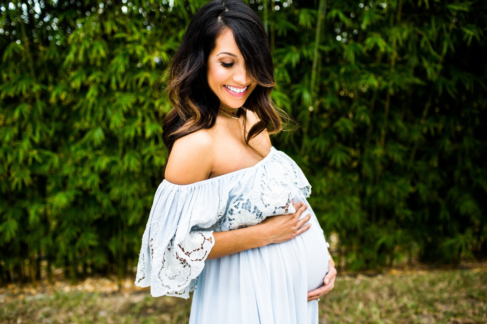 Brunette in off the shoulder maternity dress