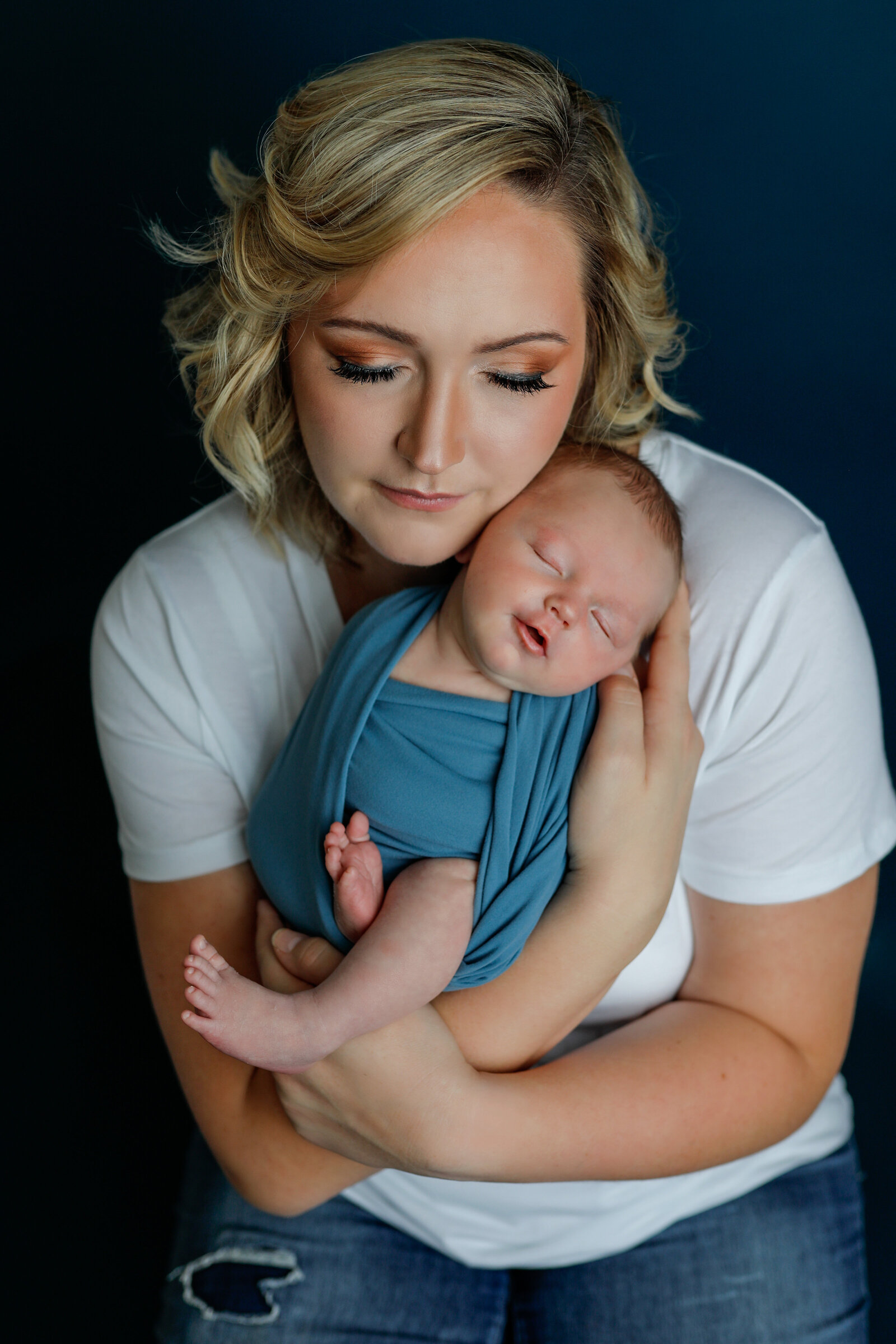 motherhood-mommy-holding-baby-blue-snuggling