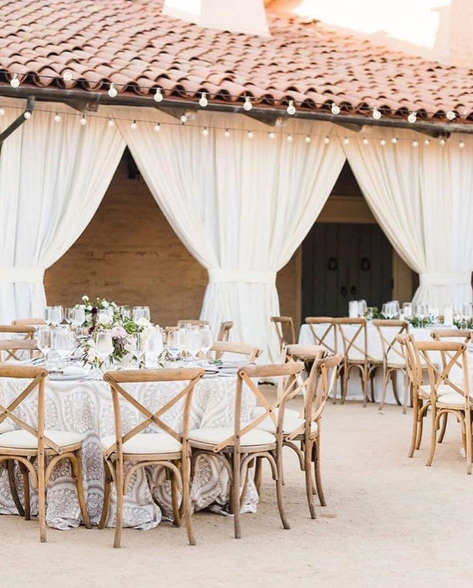 Elegant wedding set-up of tables and chairs in an outside area