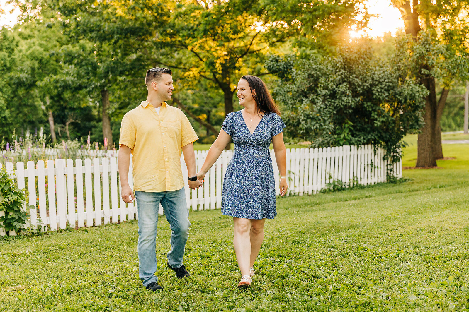 mom and dad walking outdoors by Philadelphia Family Photographer