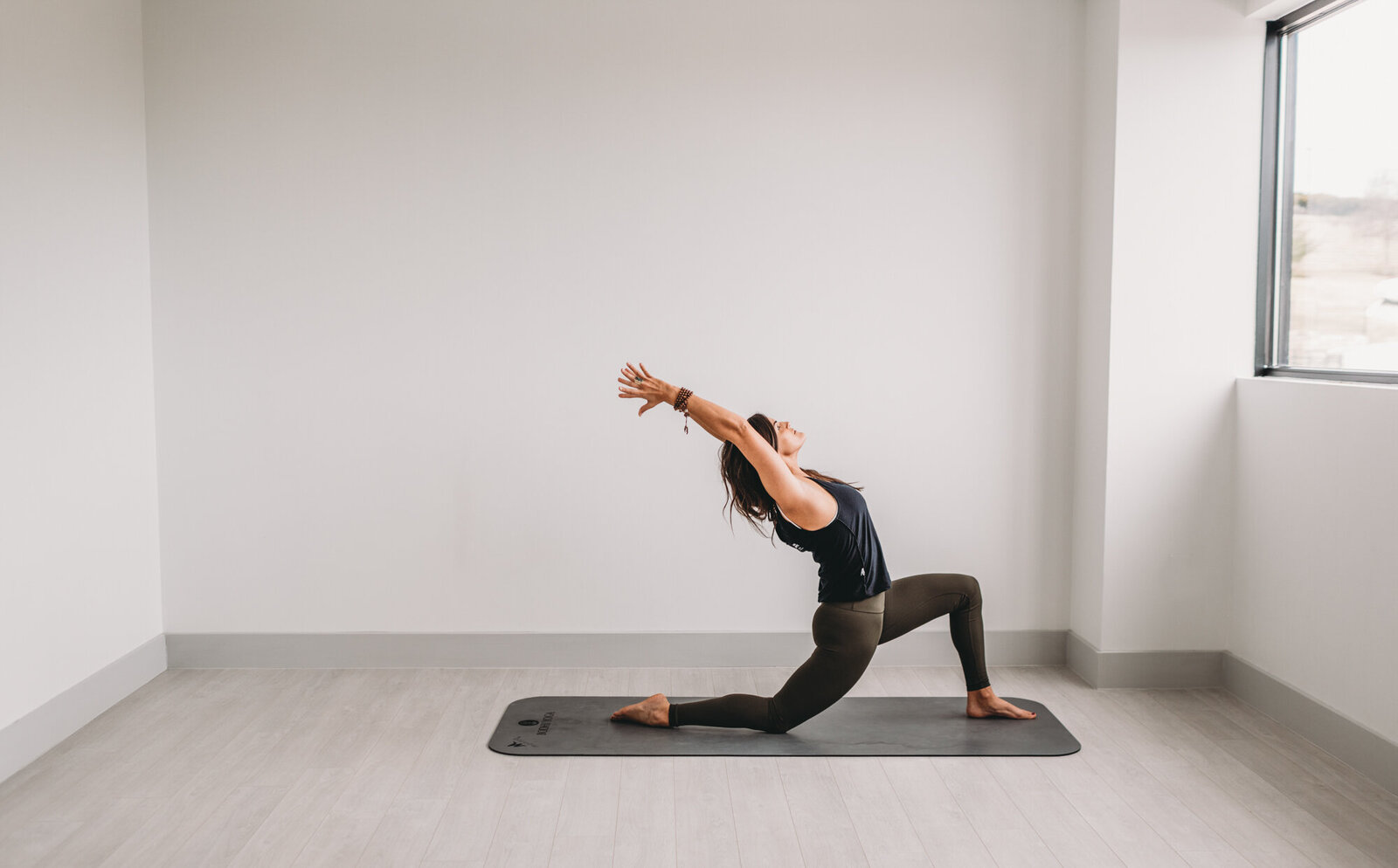 Branding Photographer, woman does yoga in an empty room