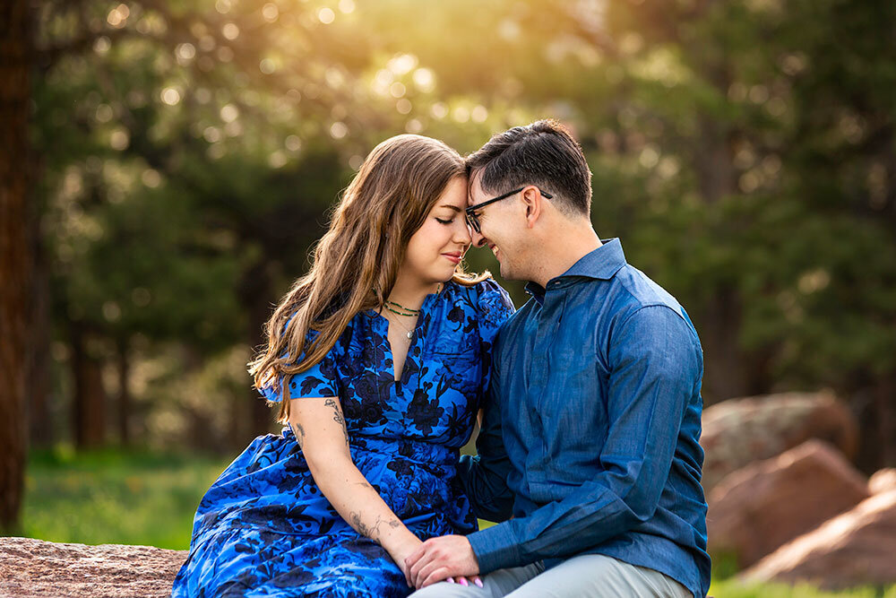 love-emotional-emotive-engagement-couple-close-up-love-vibrant-sunset-forest-green-pine-tree-mountain-setting