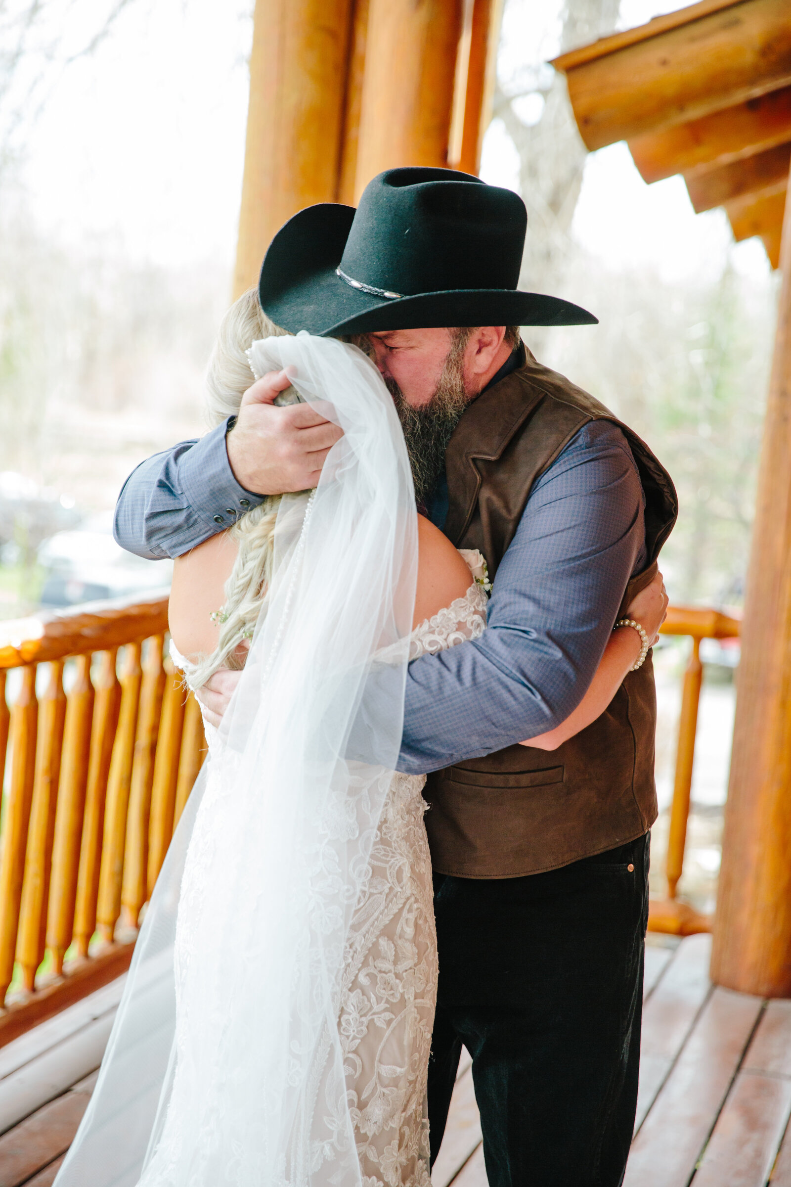 Jackson Hole photographers captures bride hugging father before Grand Teton wedding