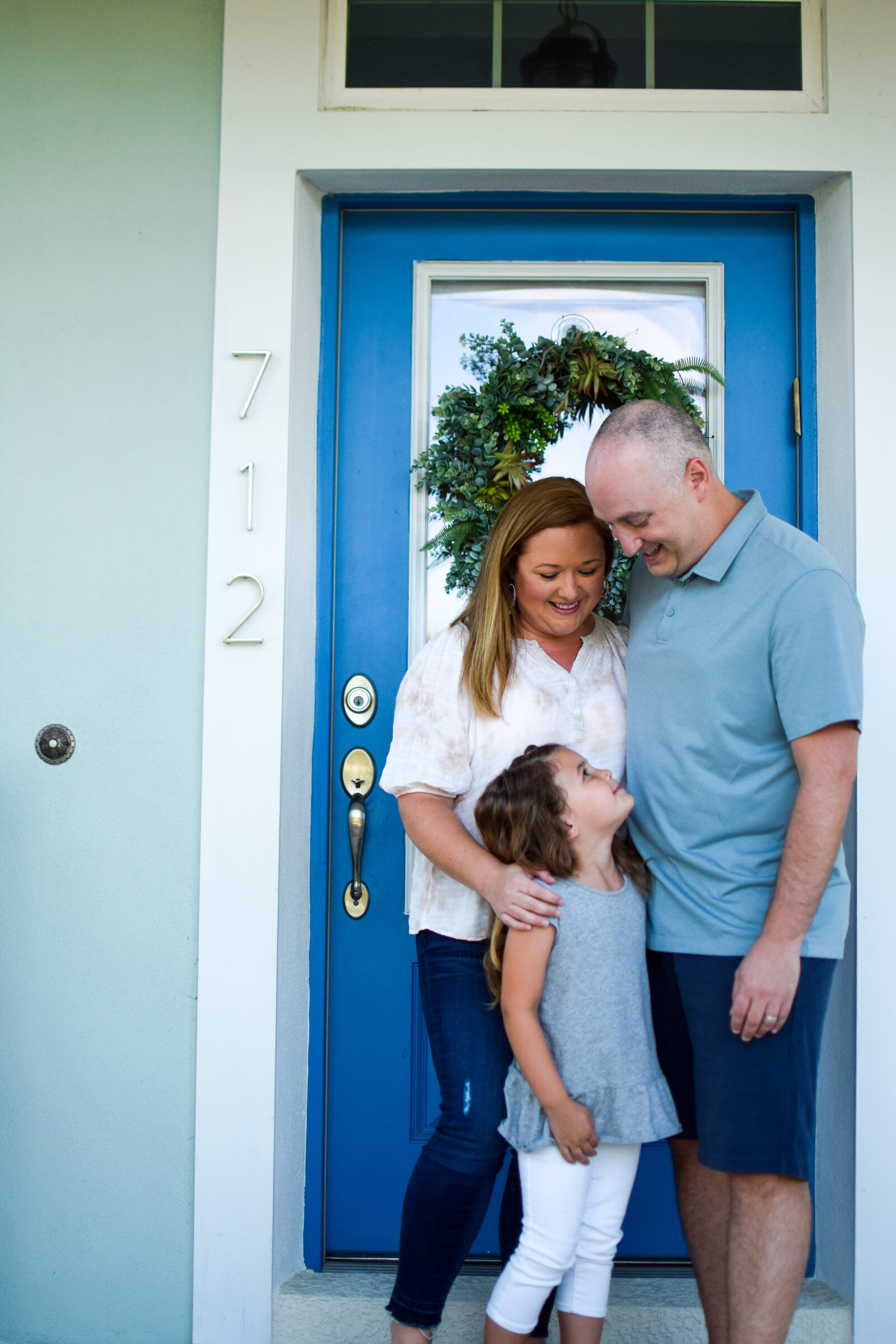 Family steps blue door Front Porch Project Oakland Florida