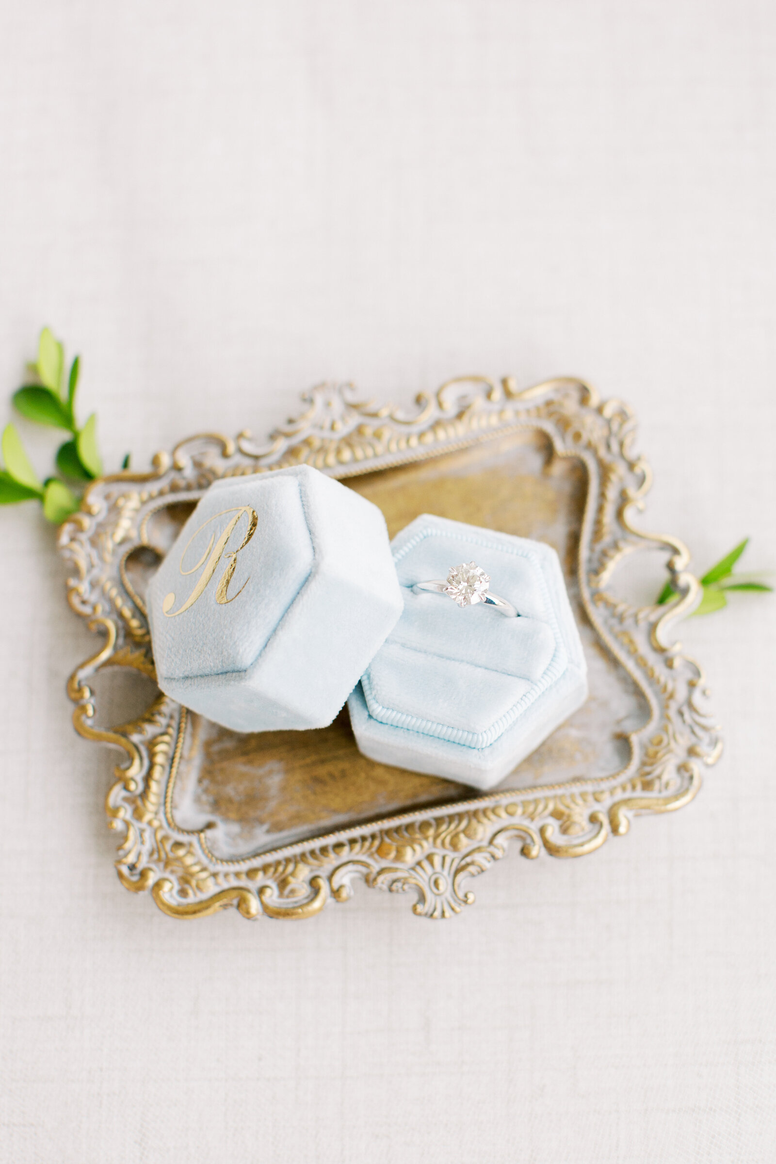 light blue velvet ring box in romantic wedding