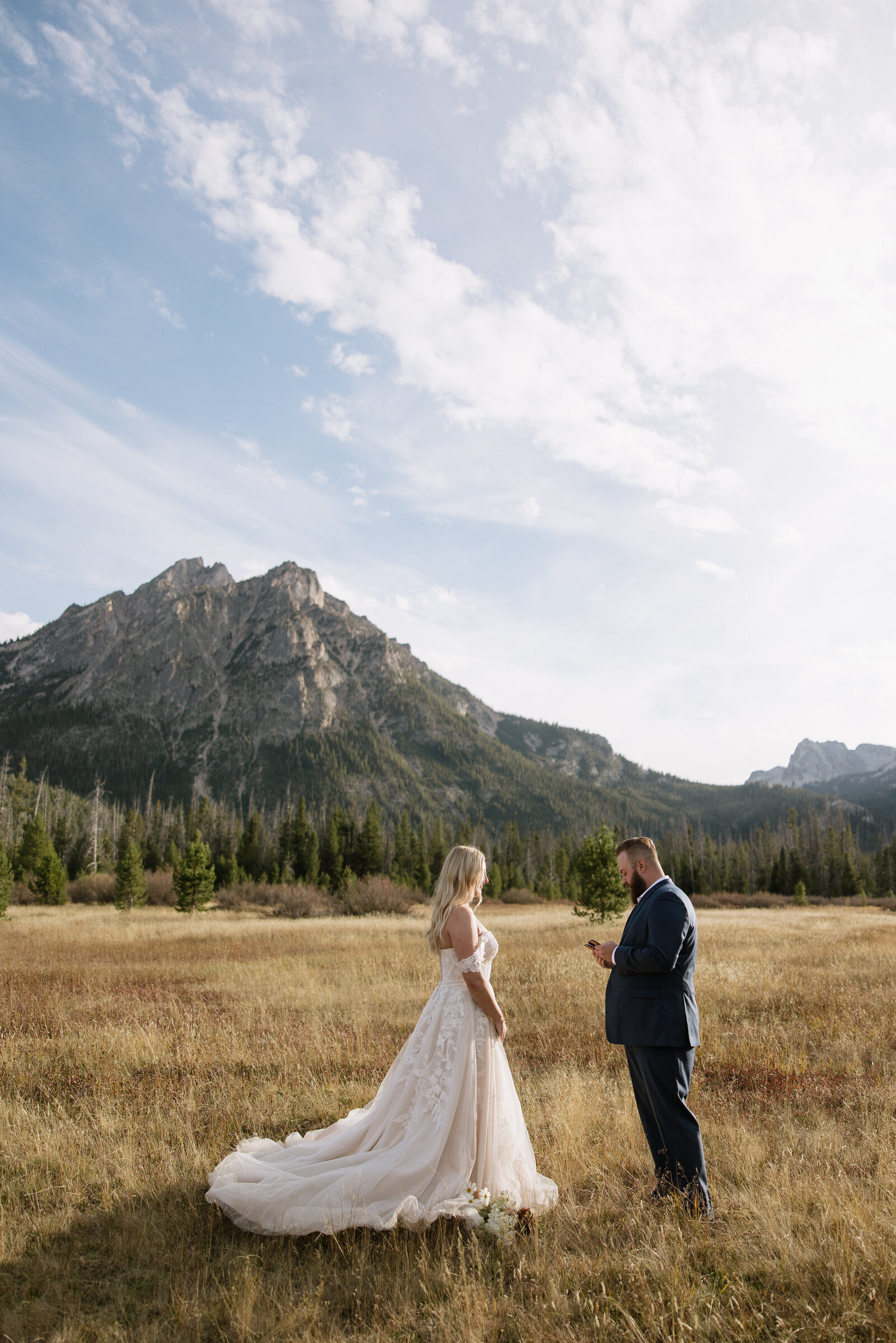 Couple exchanges private vows in front of scenic mountain backdrop in Stanley, Idaho