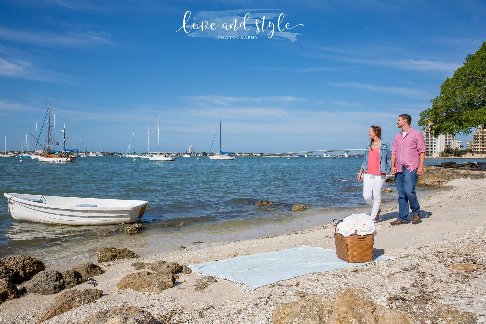 Sarasota Engagement Photography  of a couple walking on the beach in the morning  Bayfront Park